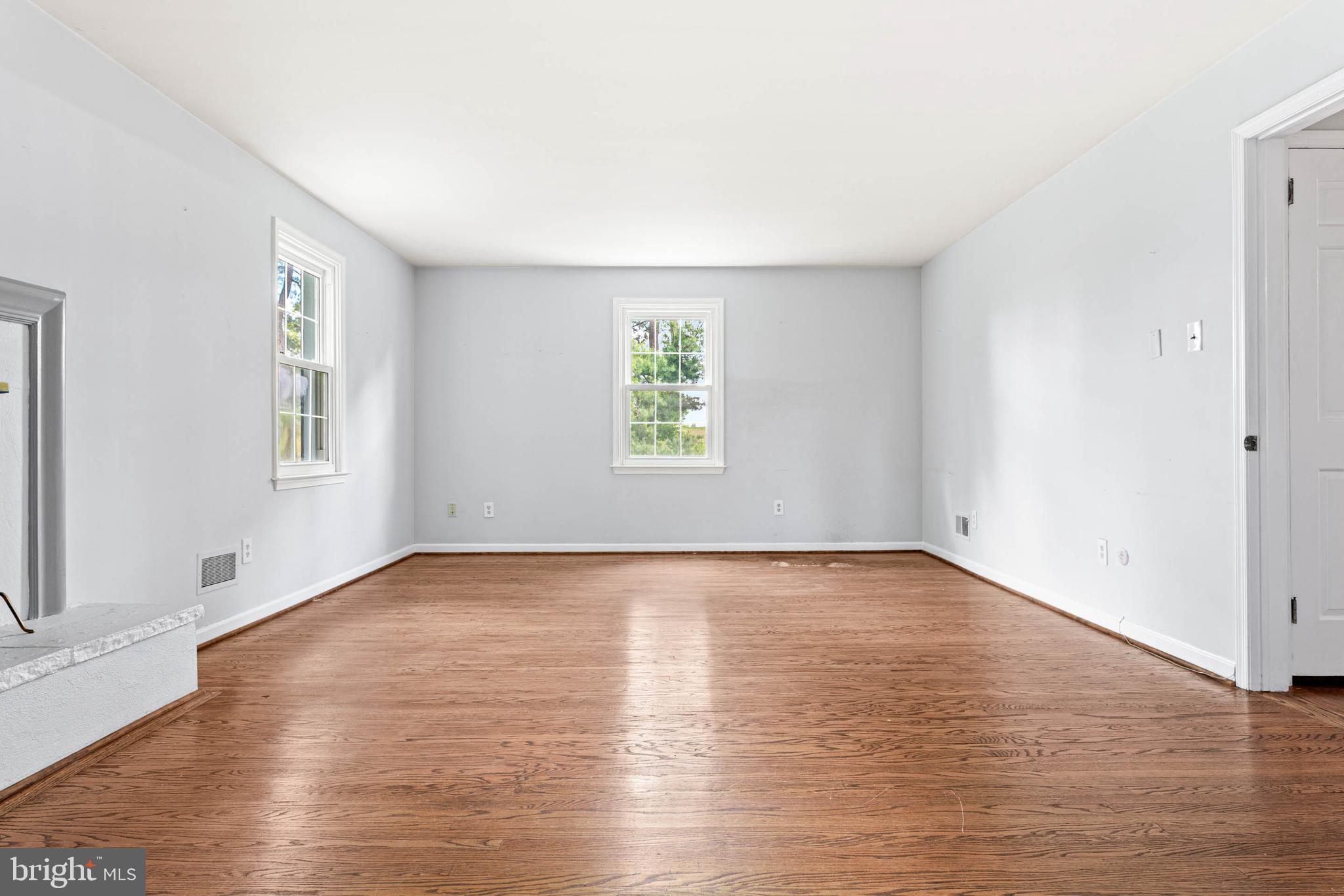 533 Gulph Road Wayne, PA 19087 - Photo 27 of 43 an empty room with wooden floor and windows