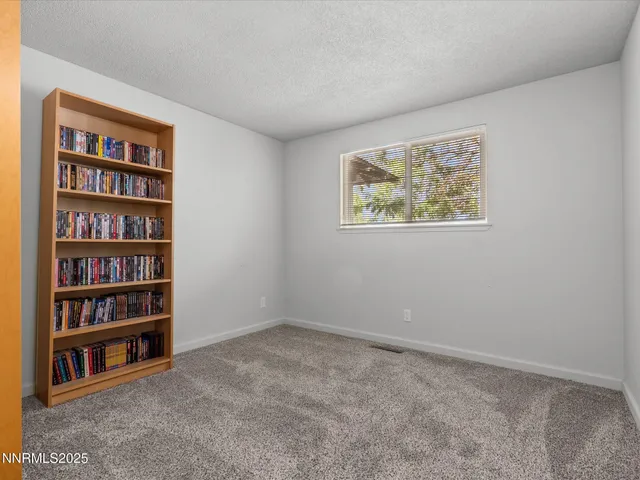 a view of yellow house with a yard