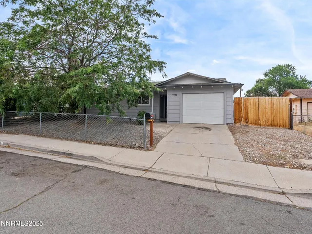 a living room with furniture a flat screen tv and a window