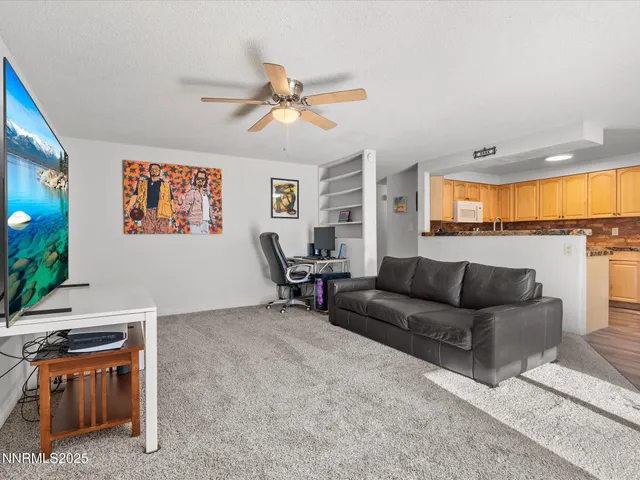 a kitchen with a table chairs refrigerator and cabinets
