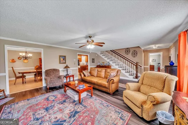 a living room with furniture and a table