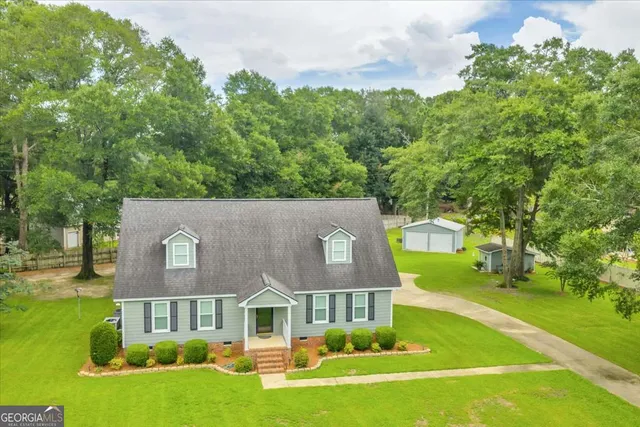 a view of a house with a big yard