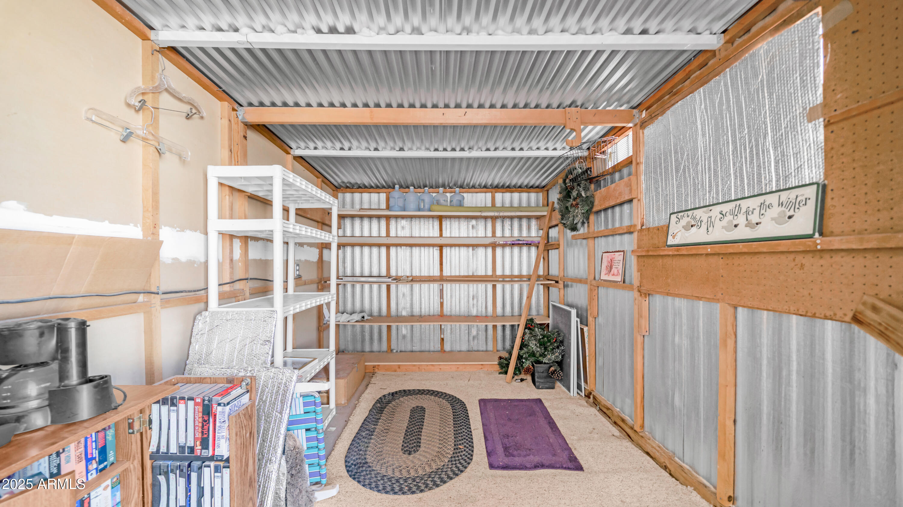 3710 South Goldfield Road, Unit 94 Apache Junction, AZ 85119 - Photo 11 of 48 a view of a hallway with washer and dryer