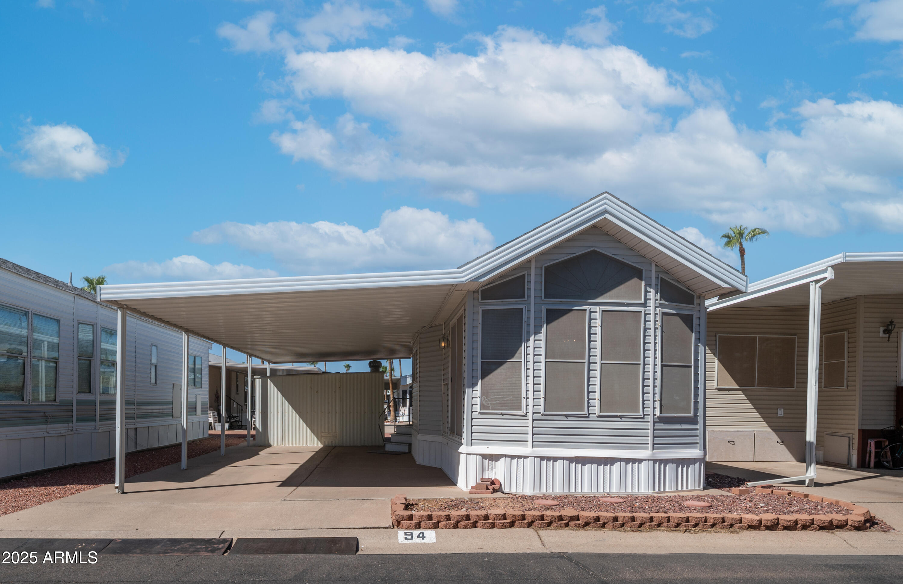 3710 South Goldfield Road, Unit 94 Apache Junction, AZ 85119 - Photo 12 of 48 a front view of a house