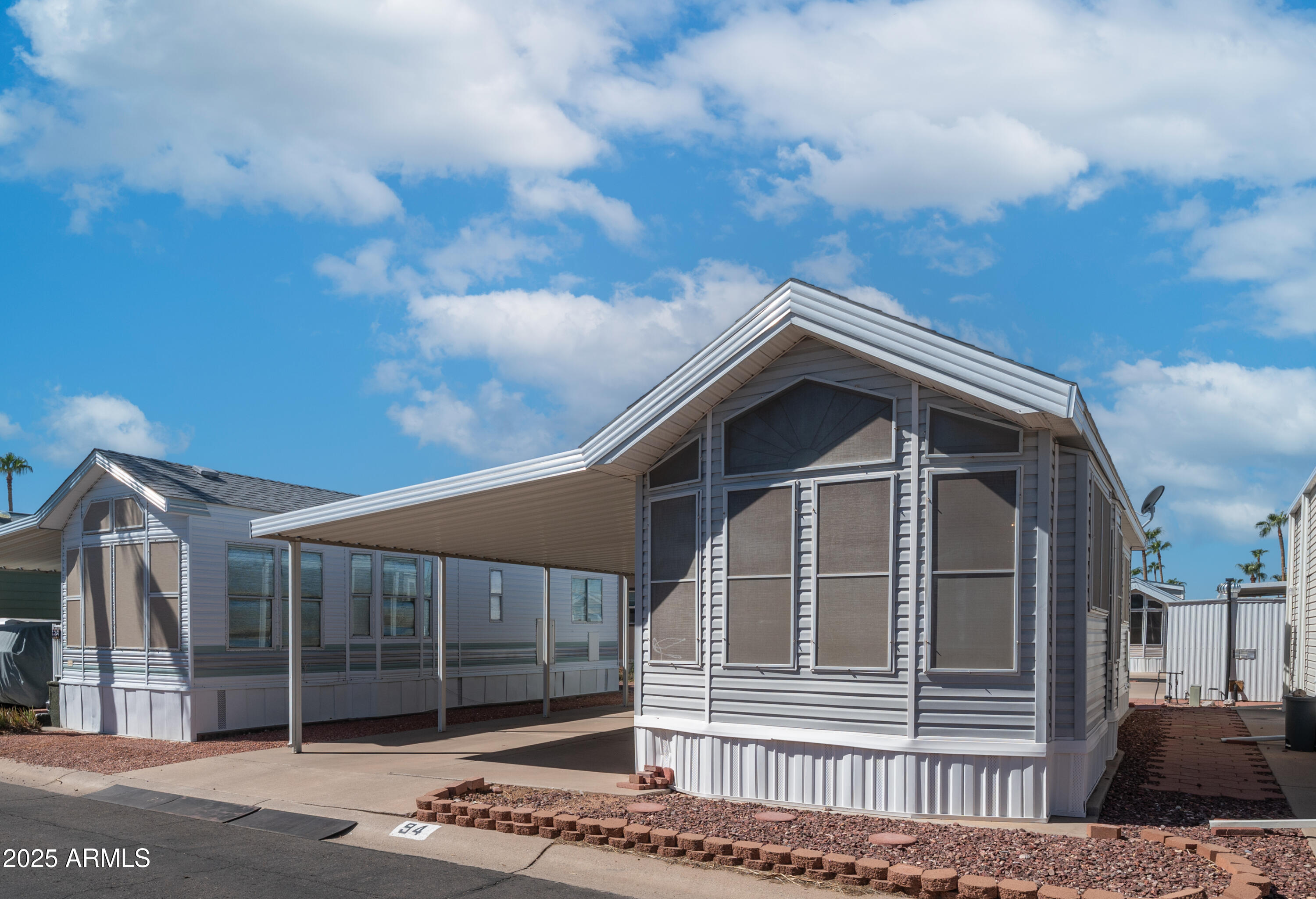 3710 South Goldfield Road, Unit 94 Apache Junction, AZ 85119 - Photo 14 of 48 a view of a house with a door