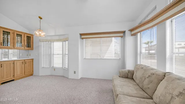 a living room with furniture and windows