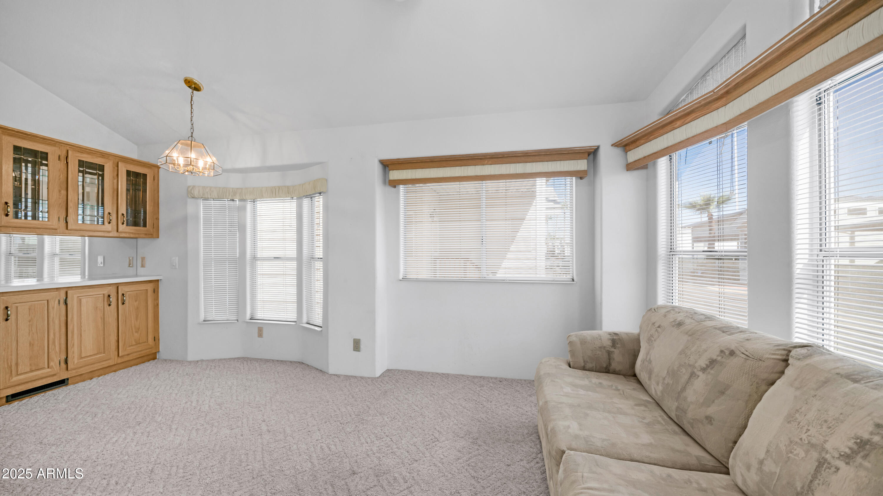 3710 South Goldfield Road, Unit 94 Apache Junction, AZ 85119 - Photo 3 of 48 a living room with furniture and windows