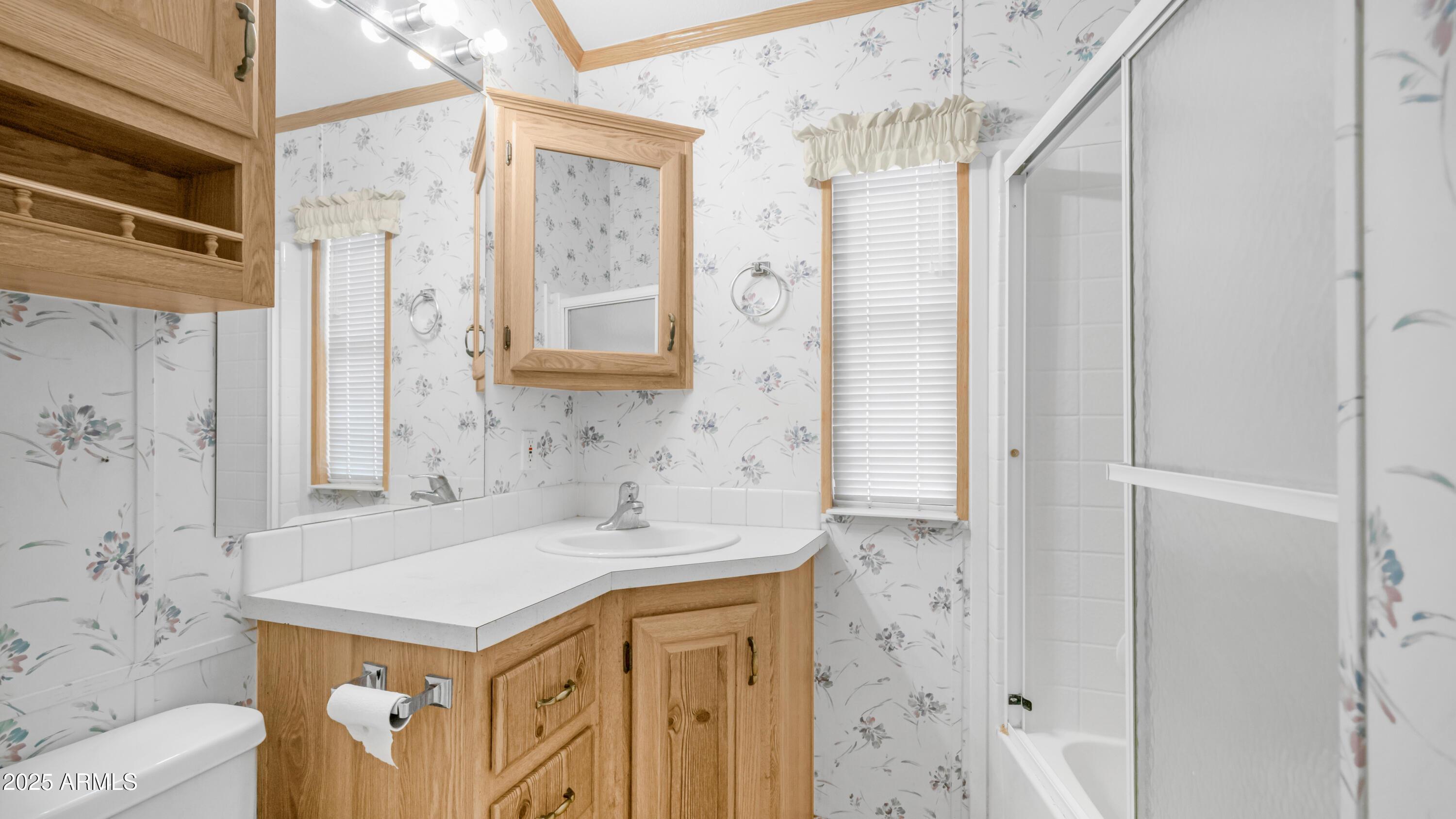 3710 South Goldfield Road, Unit 94 Apache Junction, AZ 85119 - Photo 8 of 48 a bathroom with a sink a vanity and a mirror