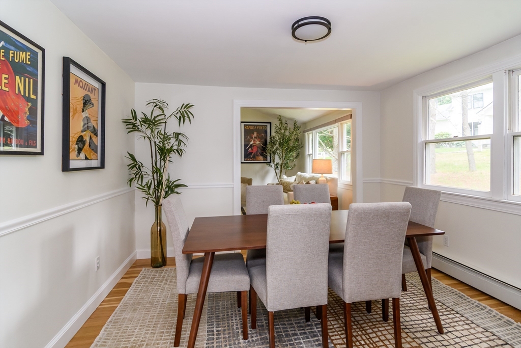 124 Everett Street Natick, MA 01760 - Photo 8 of 36 a view of a dining room with furniture window and wooden floor