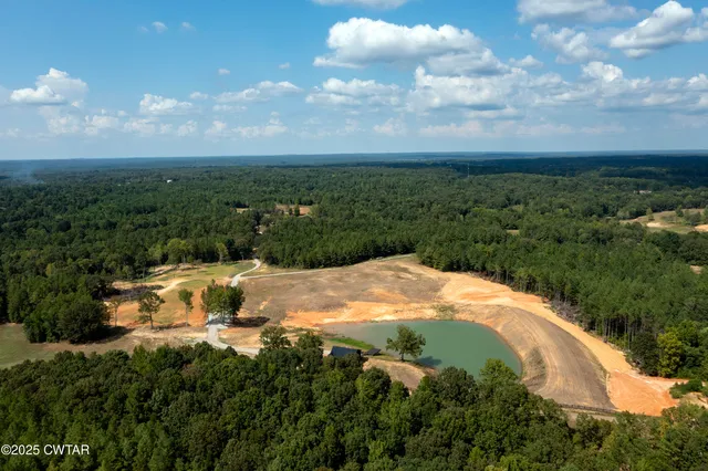 a view of a lake with a yard