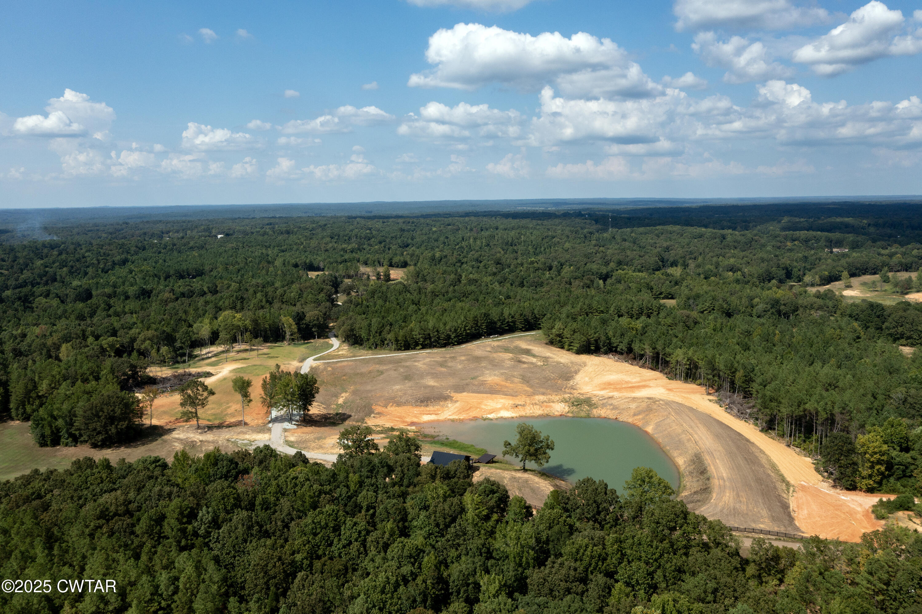 820 Tyson Road Toone, TN 38381 - Photo 14 of 31 a view of a lake with a yard