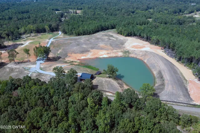 an aerial view of a house with mountain view