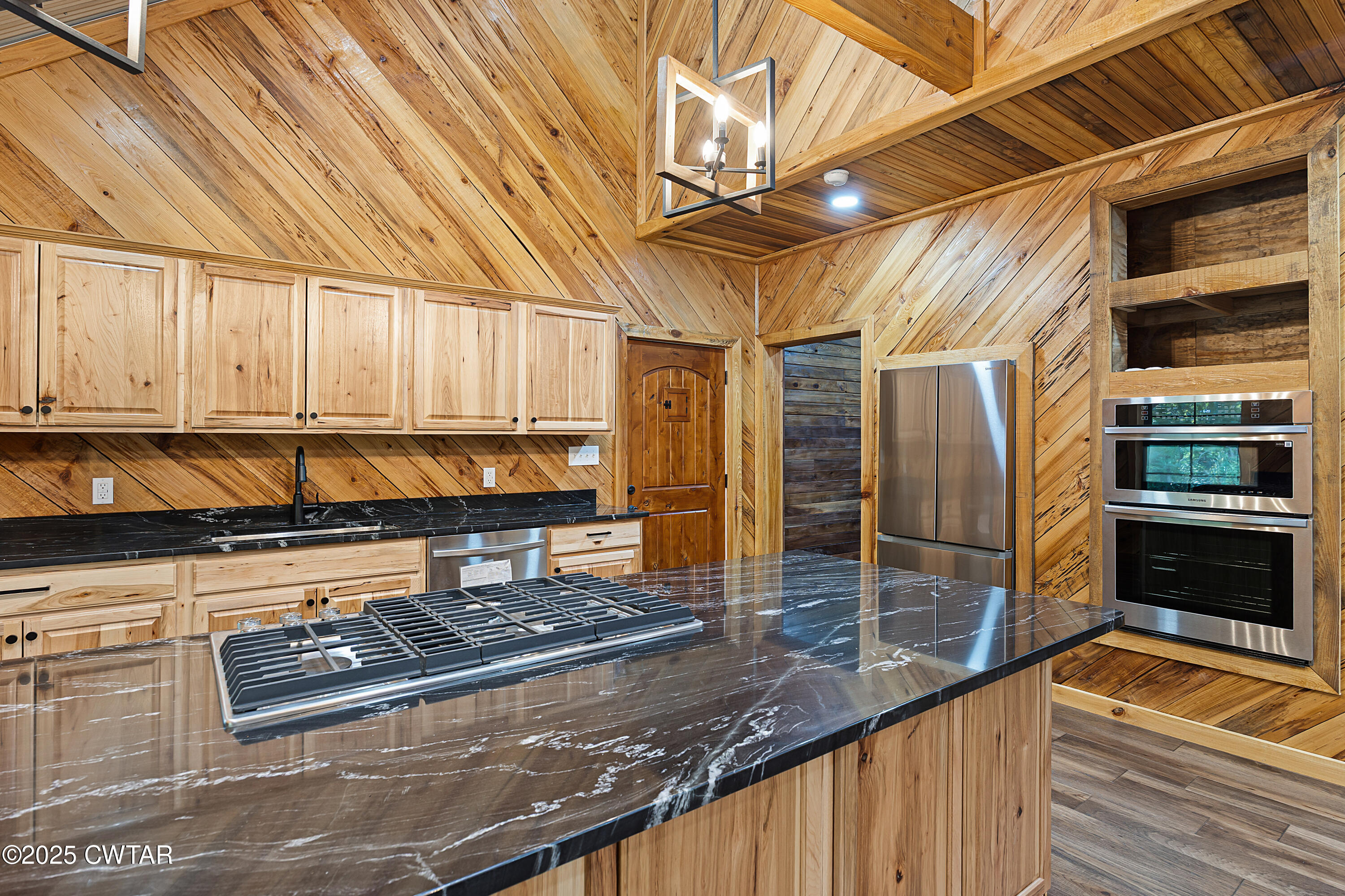 820 Tyson Road Toone, TN 38381 - Photo 18 of 31 a kitchen with stainless steel appliances granite countertop a stove and a sink