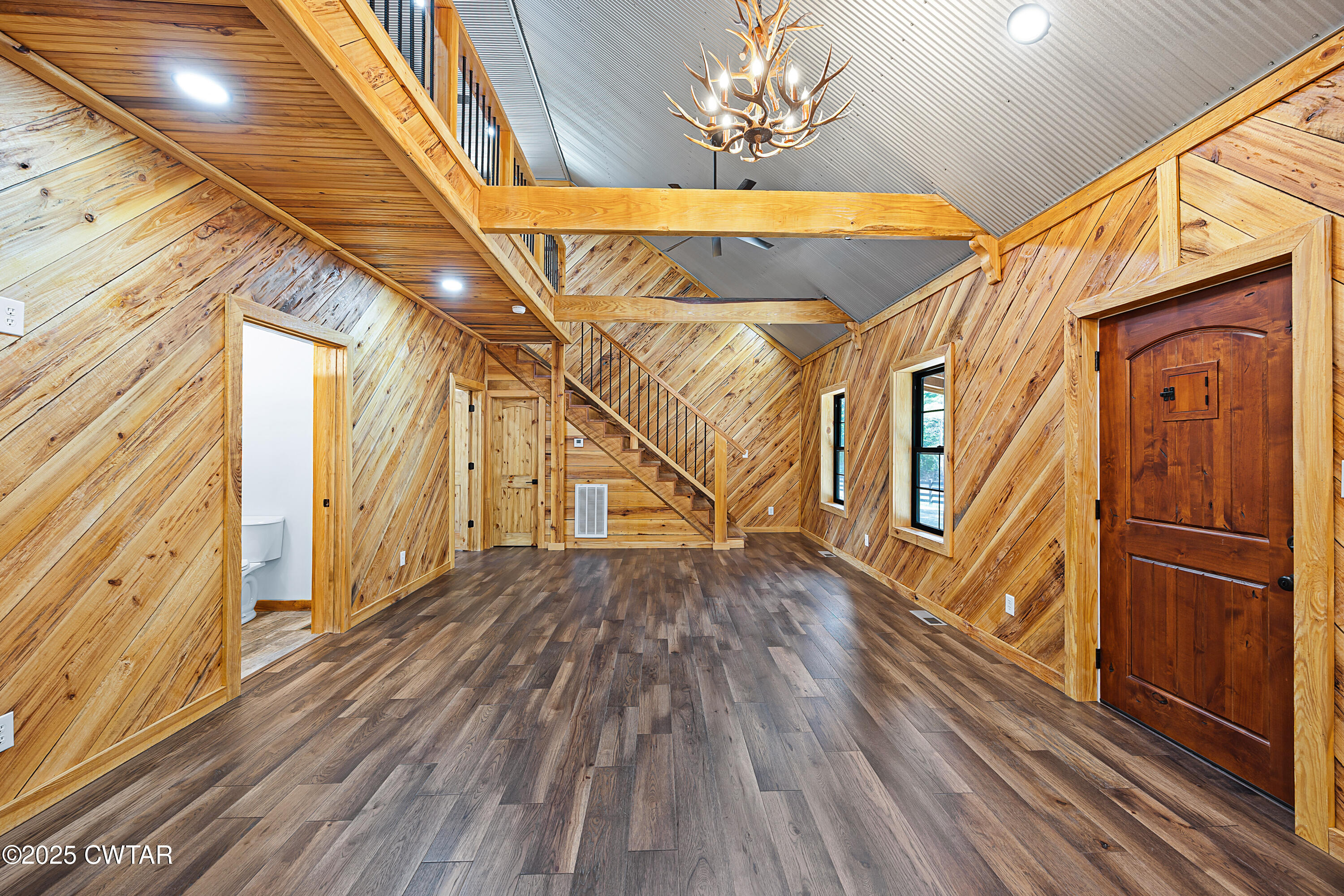 820 Tyson Road Toone, TN 38381 - Photo 23 of 31 a view of a room with wooden floor and staircase