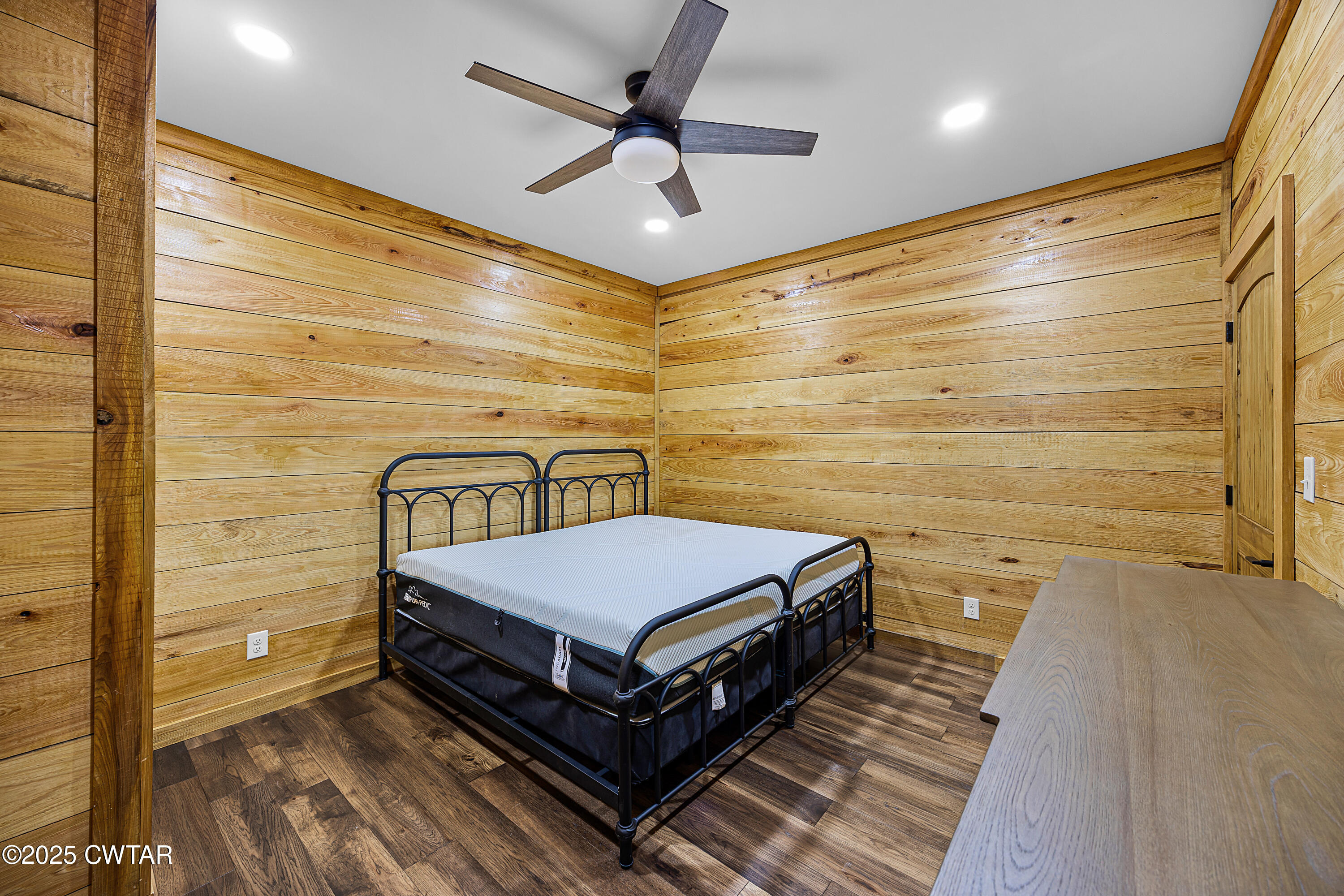 820 Tyson Road Toone, TN 38381 - Photo 26 of 31 a spacious bedroom with a bed and a ceiling fan