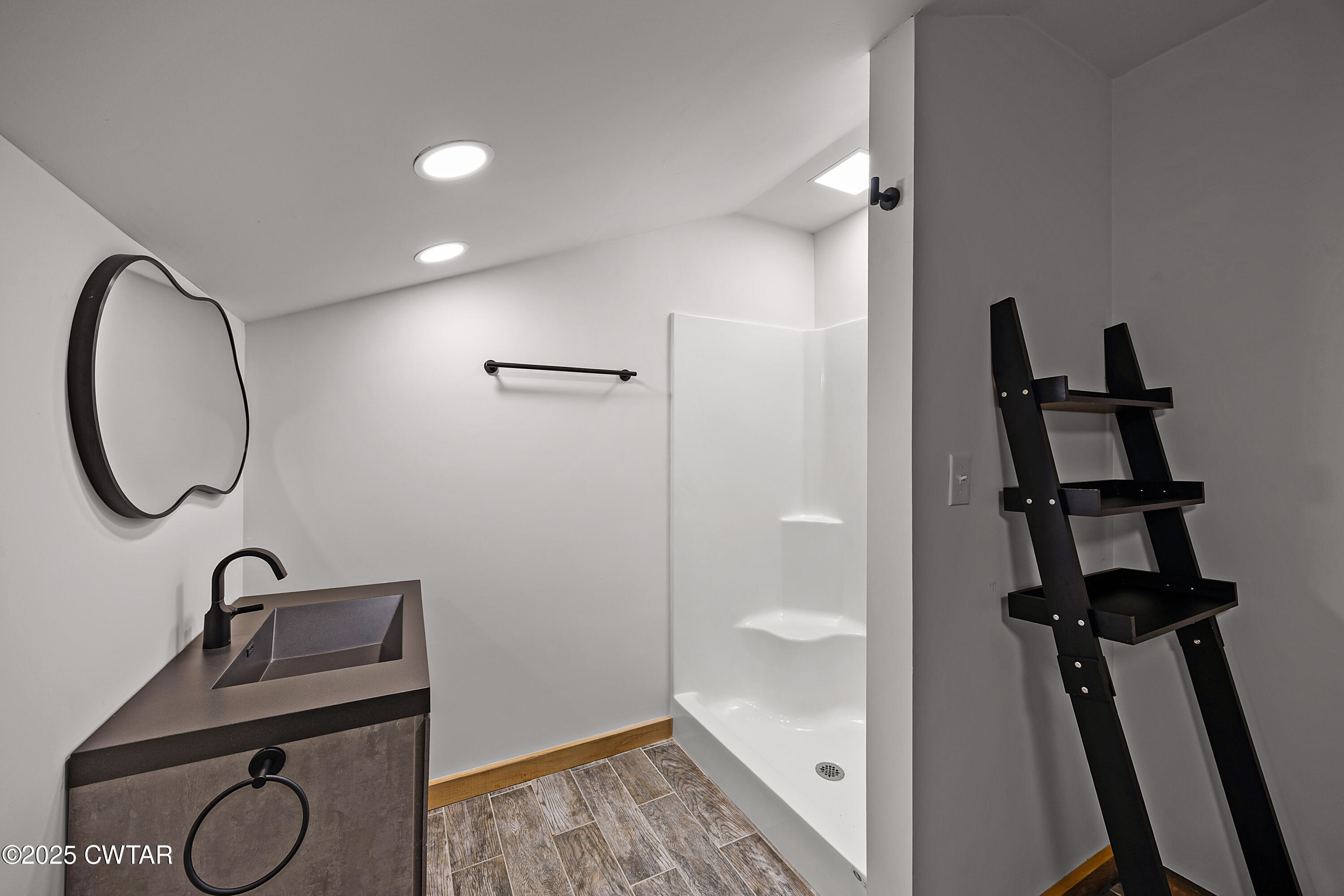 820 Tyson Road Toone, TN 38381 - Photo 29 of 31 a bathroom with a sink and a mirror