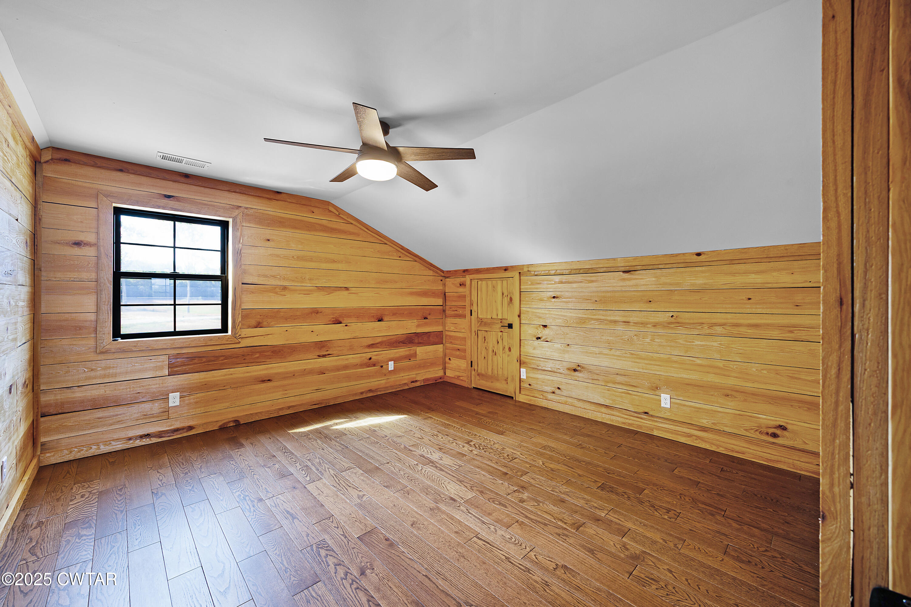 820 Tyson Road Toone, TN 38381 - Photo 30 of 31 a view of an empty room with wooden floor and a window