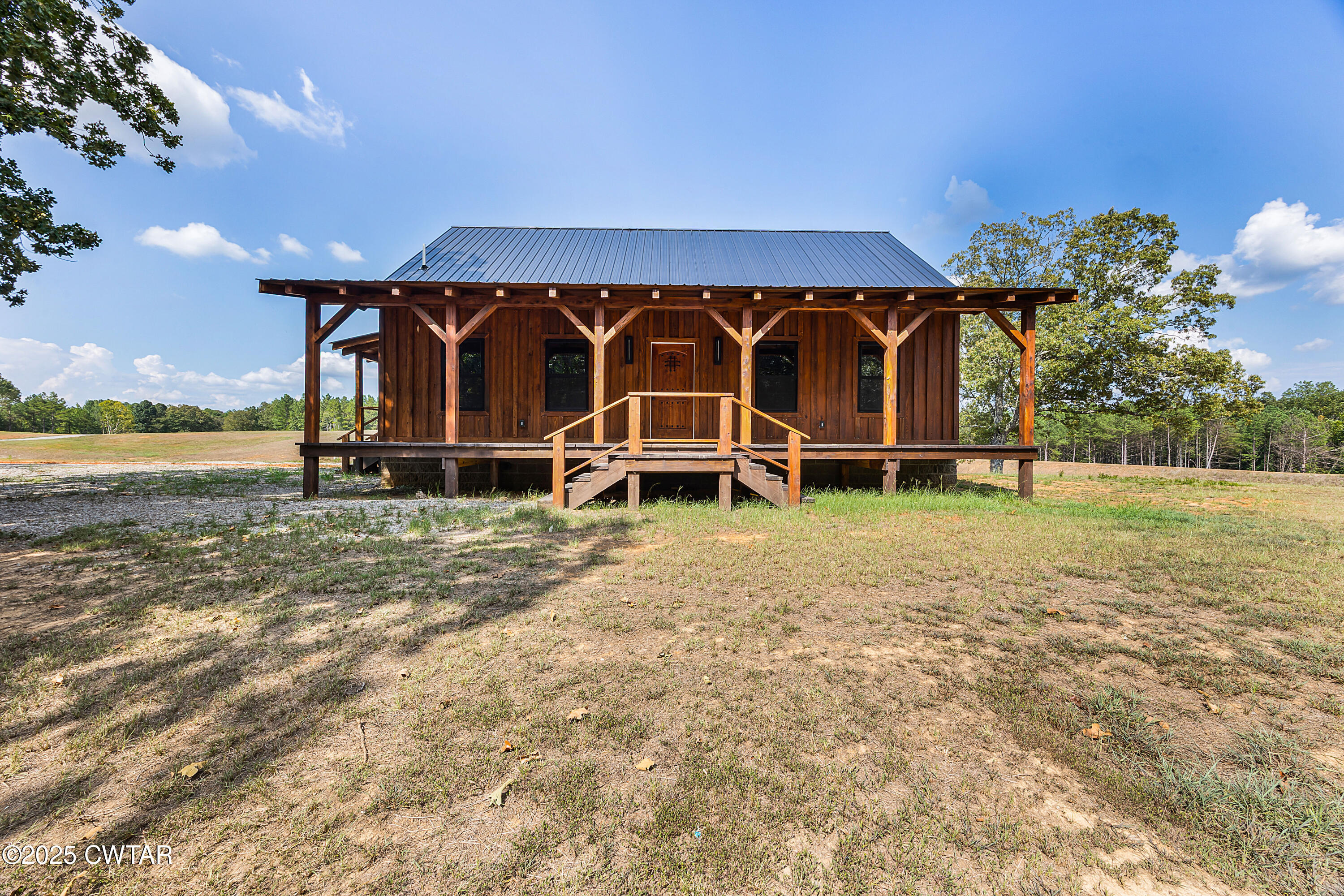 820 Tyson Road Toone, TN 38381 - Photo 3 of 31 a front view of a house with garden