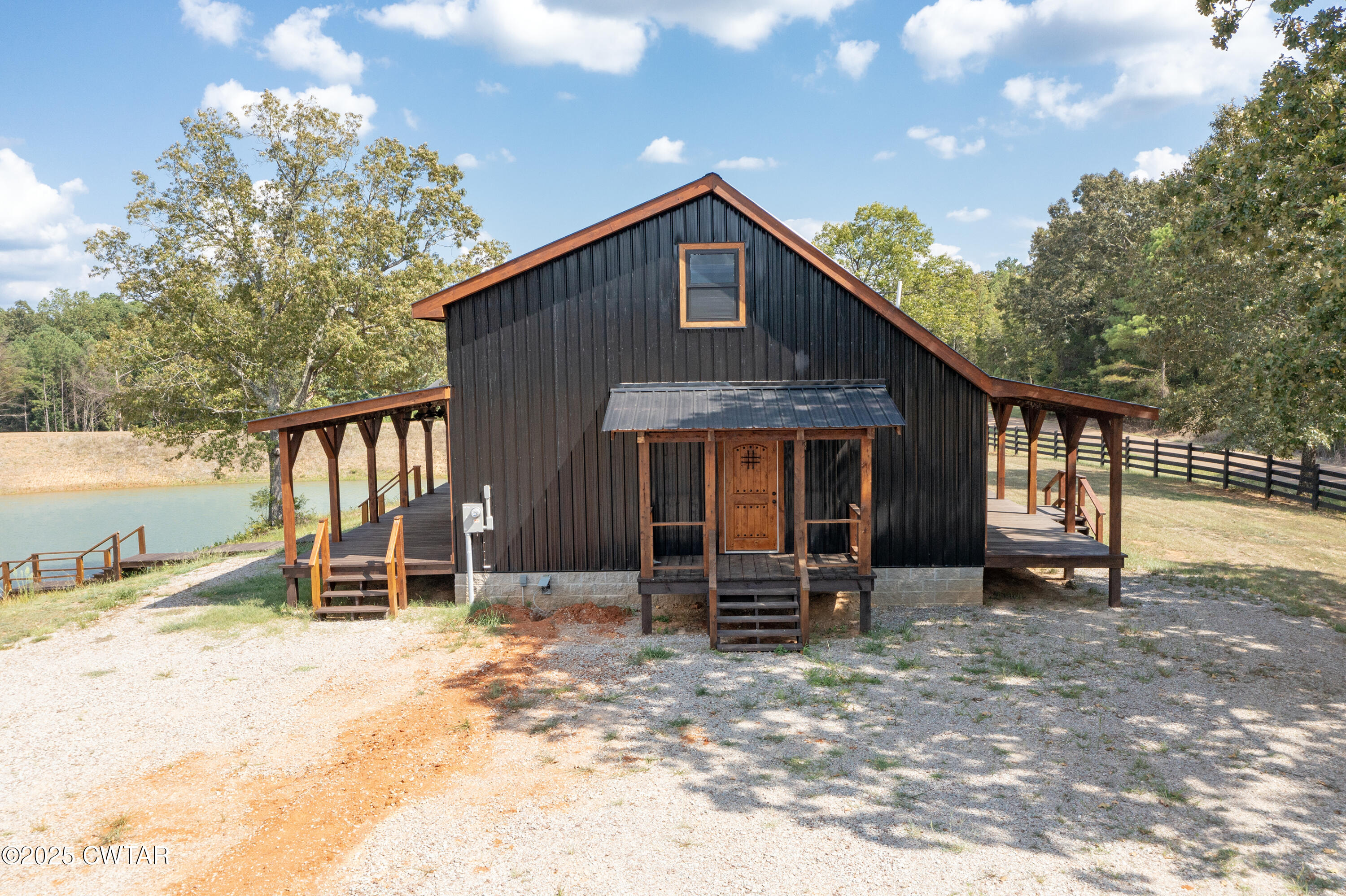 820 Tyson Road Toone, TN 38381 - Photo 5 of 31 a front view of a house with garden