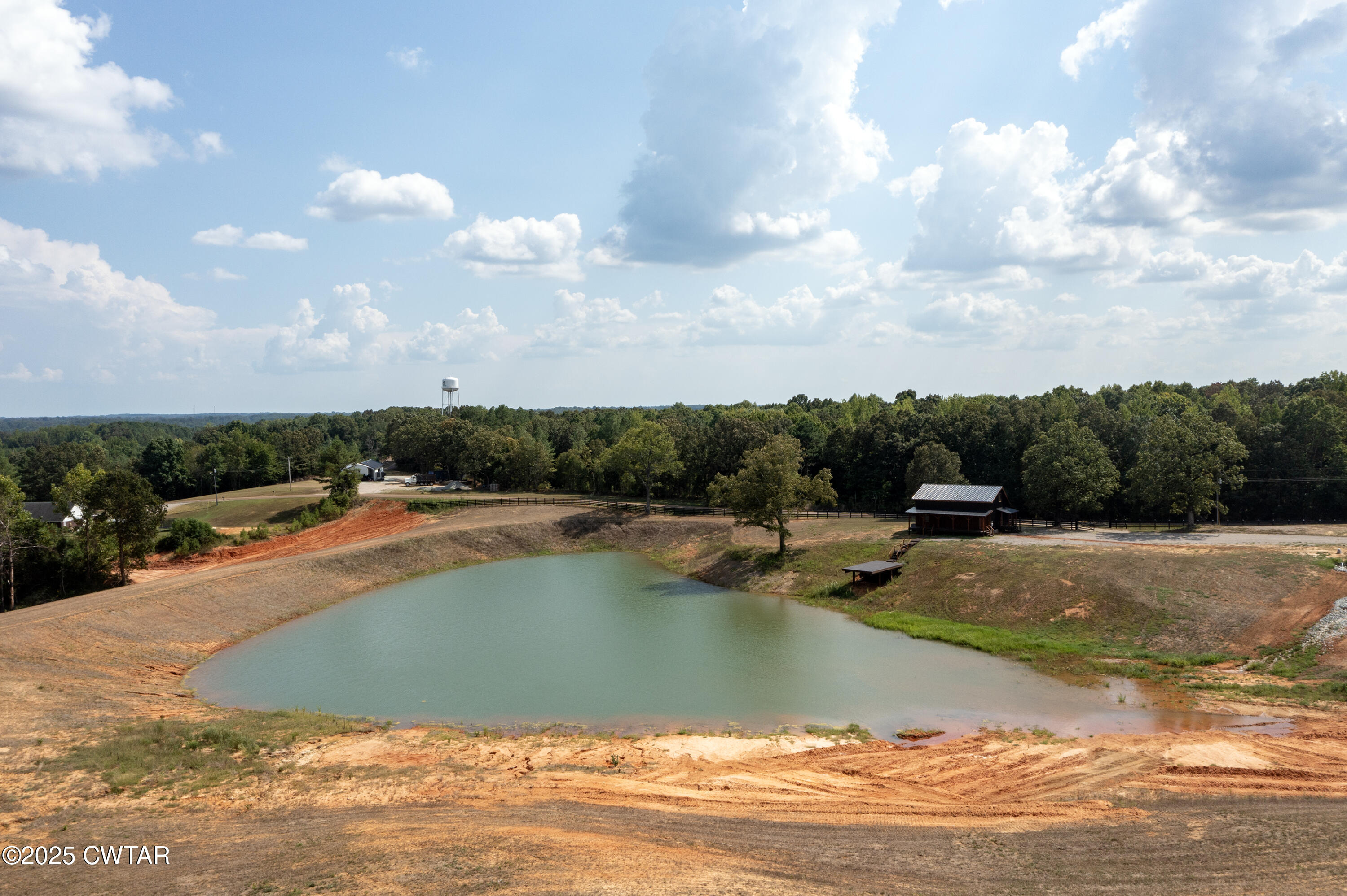 820 Tyson Road Toone, TN 38381 - Photo 6 of 31 a view of a swimming pool and lake