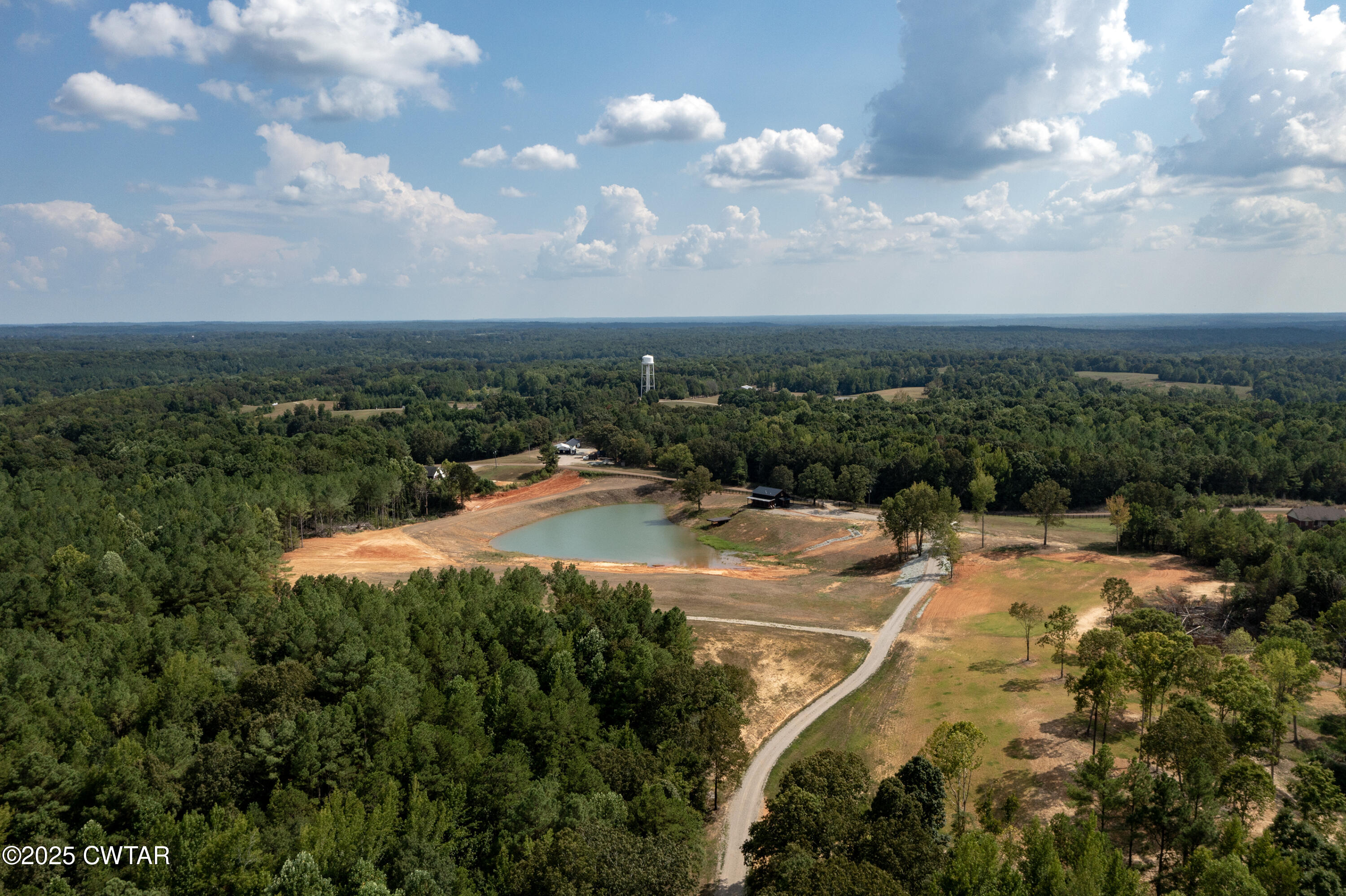 820 Tyson Road Toone, TN 38381 - Photo 7 of 31 a view of a swimming pool with a yard