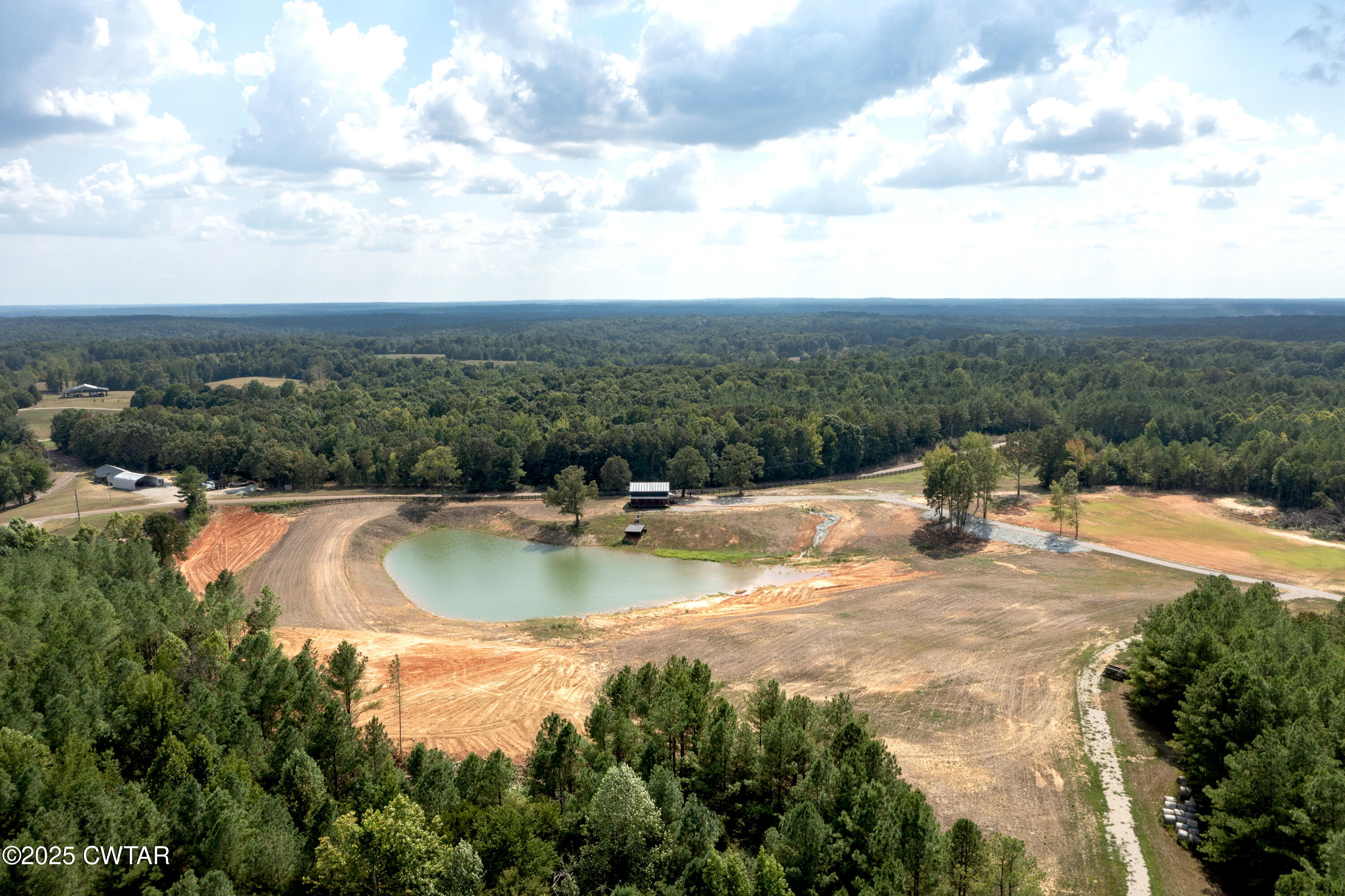 820 Tyson Road Toone, TN 38381 - Photo 8 of 31 a view of a swimming pool with a yard