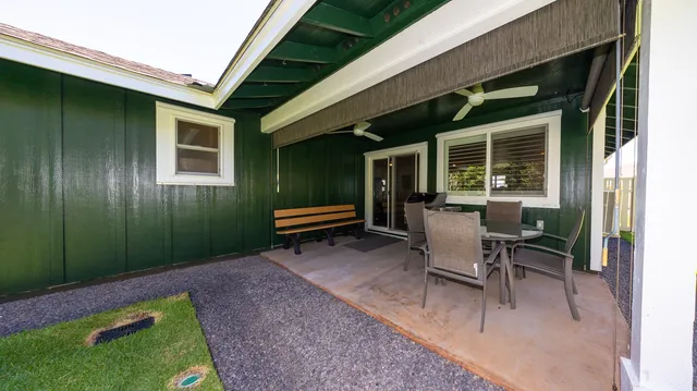 an aerial view of a city with lots of residential buildings and mountain in the back