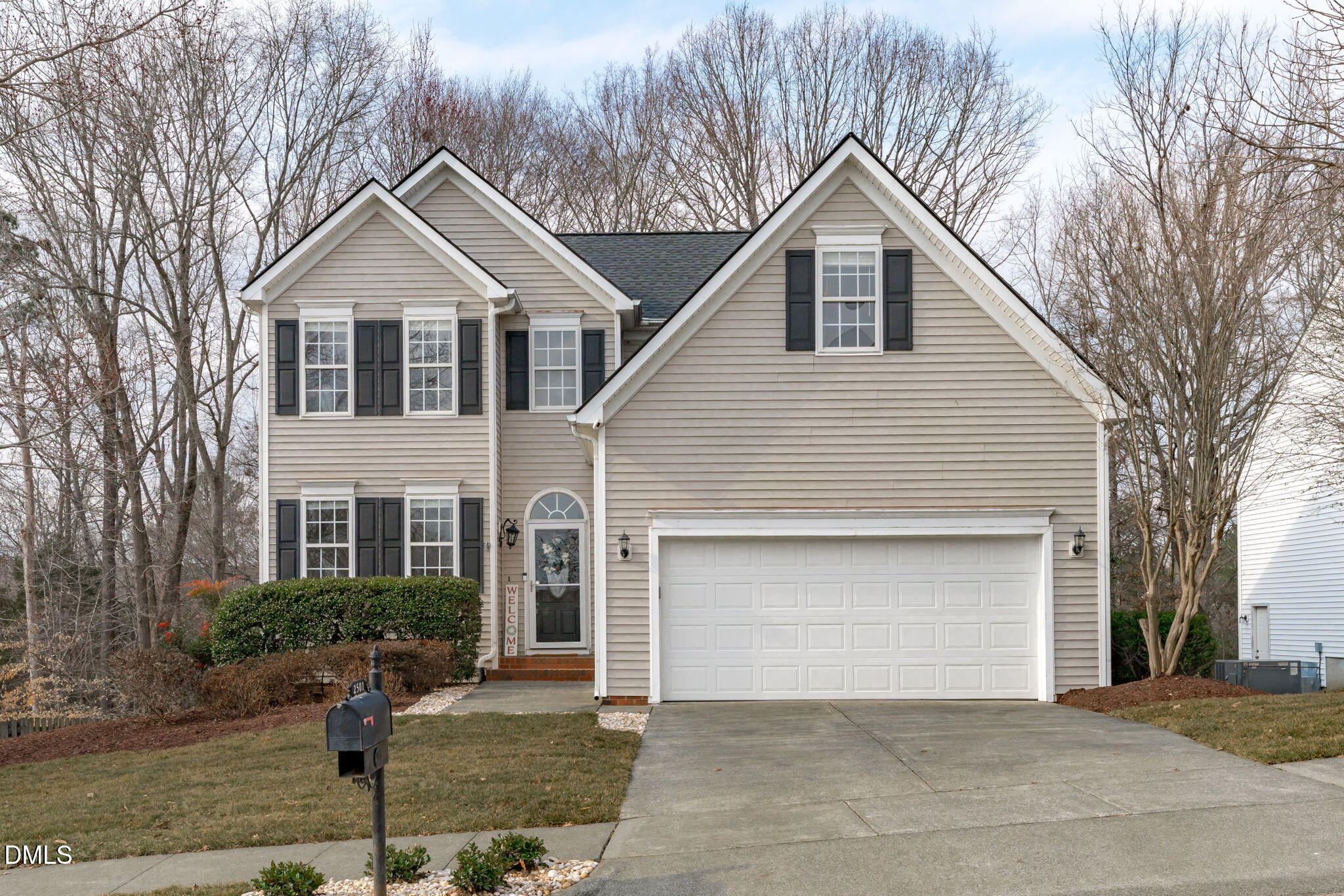 2501 Springfield Park Drive Raleigh, NC 27614 - Photo 2 of 44 a front view of a house with a yard and garage