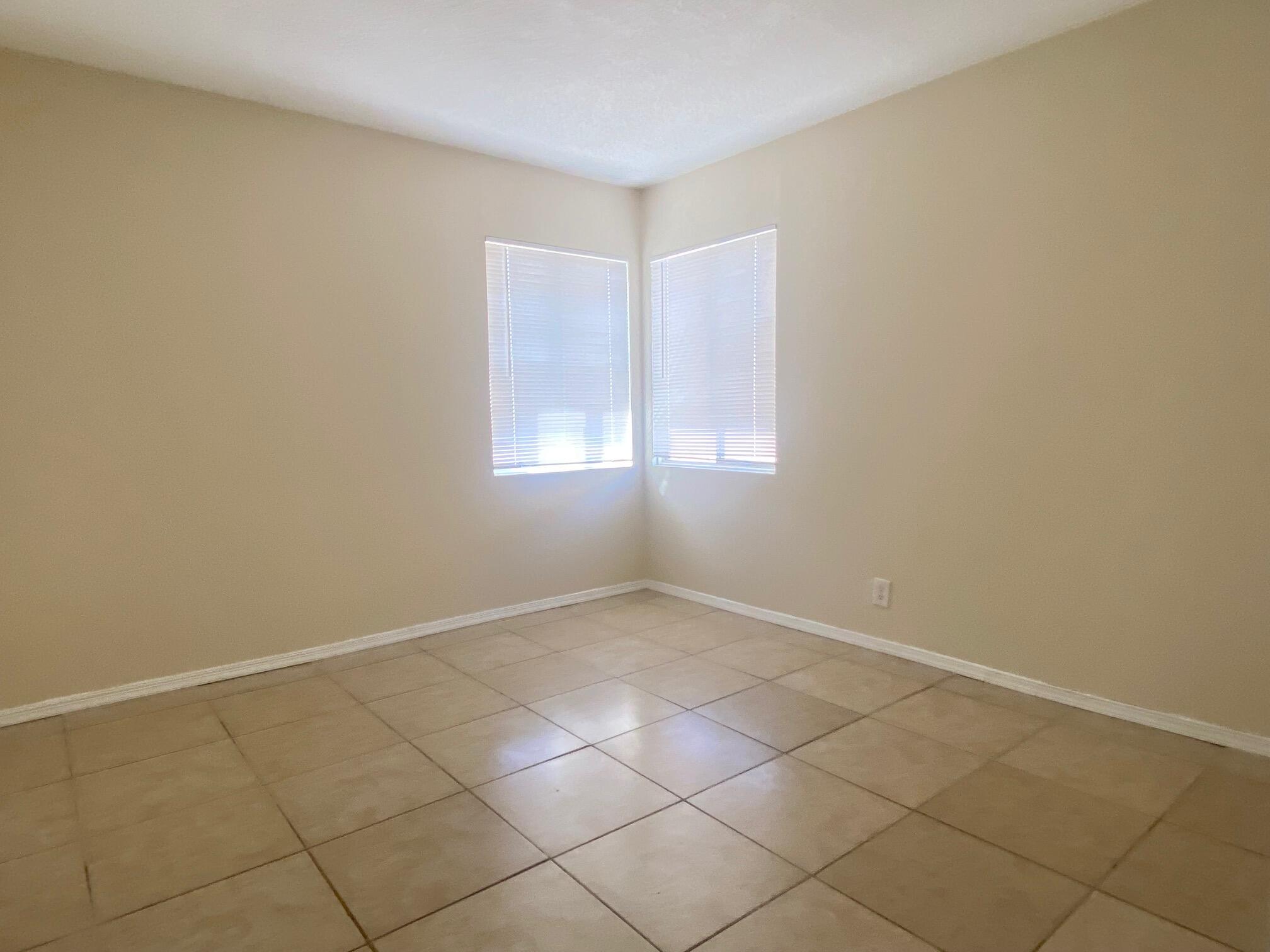 45325 Raysack Avenue Lancaster, CA 93535 - Photo 13 of 17 an empty room with windows