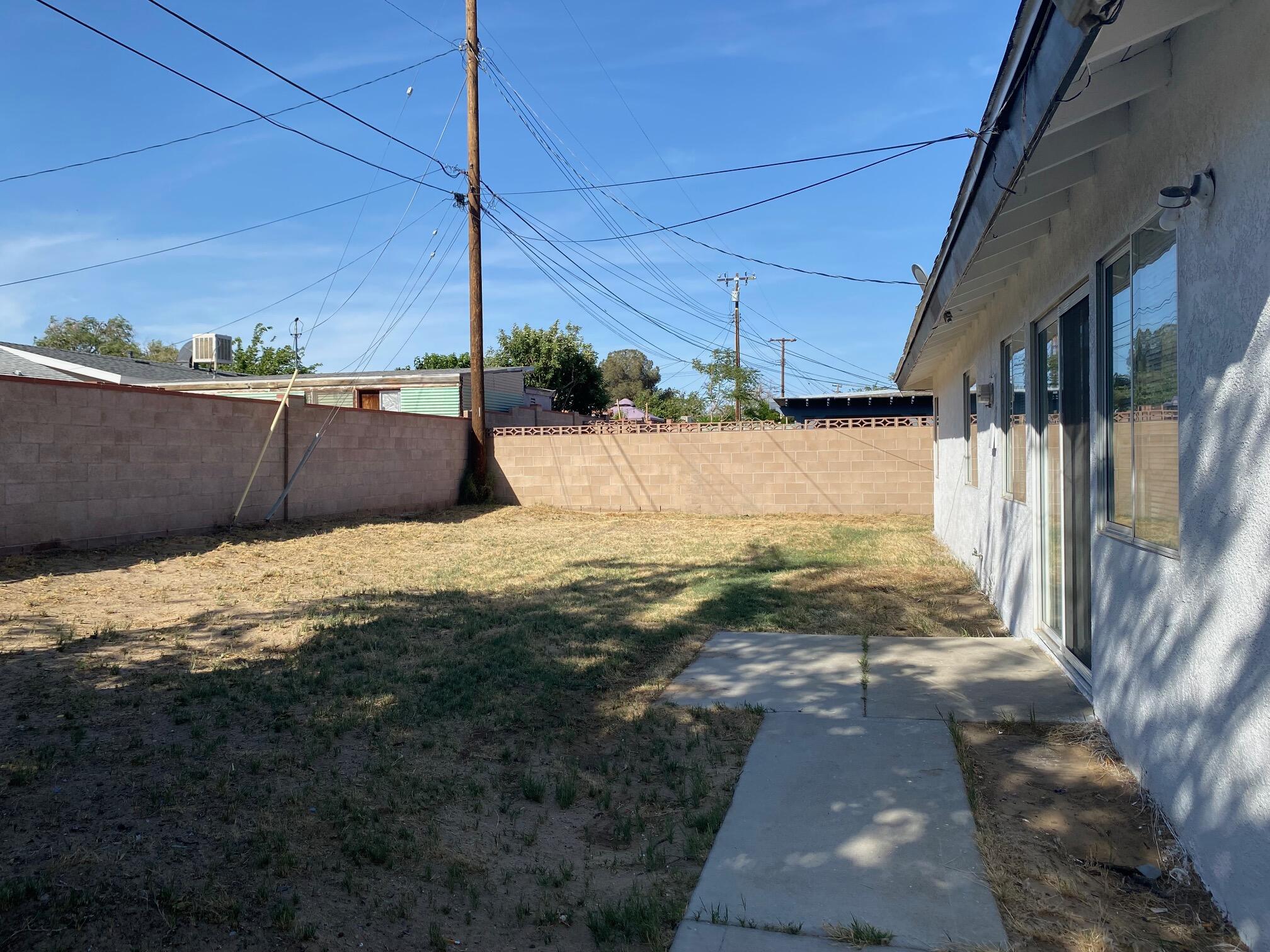 45325 Raysack Avenue Lancaster, CA 93535 - Photo 14 of 17 a view of a backyard of the house