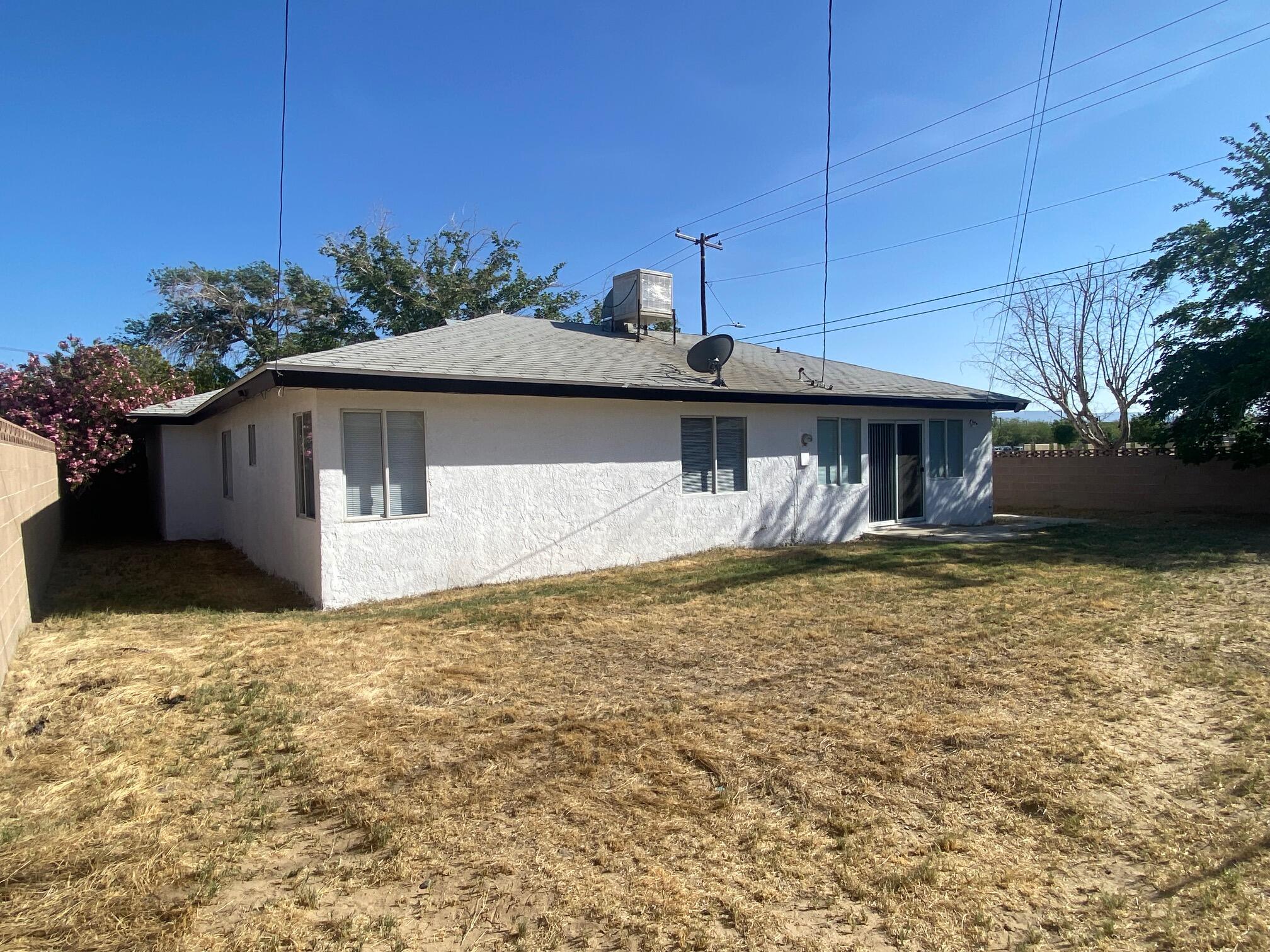 45325 Raysack Avenue Lancaster, CA 93535 - Photo 15 of 17 a front view of a house with garden