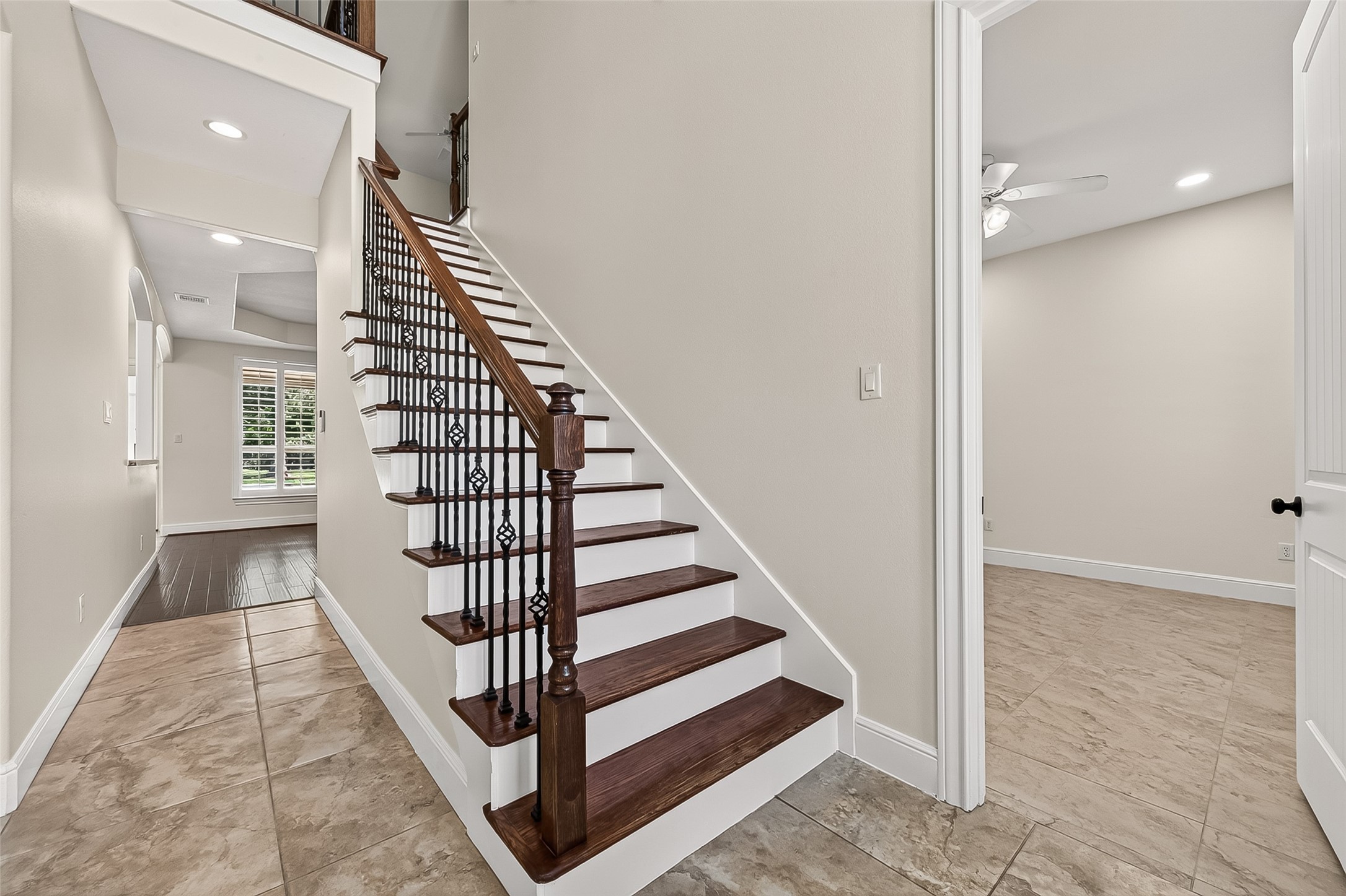 22040 Robins Road Hockley, TX 77447 - Photo 5 of 44 Wood stairs with elegant rod iron rails