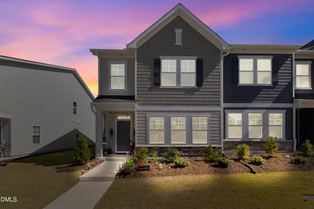 a front view of a house with a yard