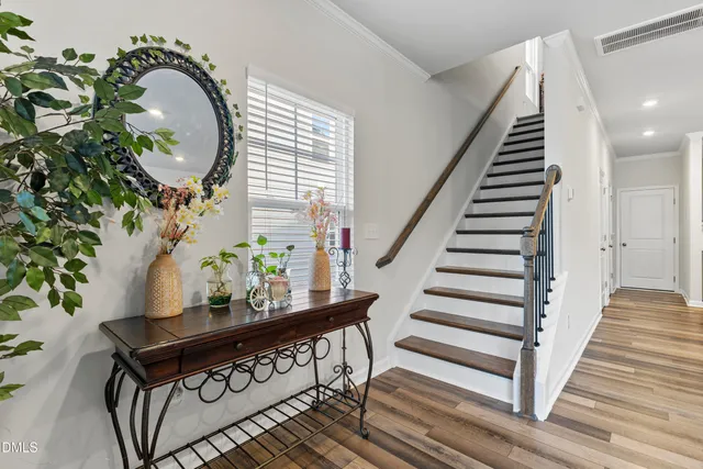 a kitchen that has a sink stainless steel appliances and cabinets