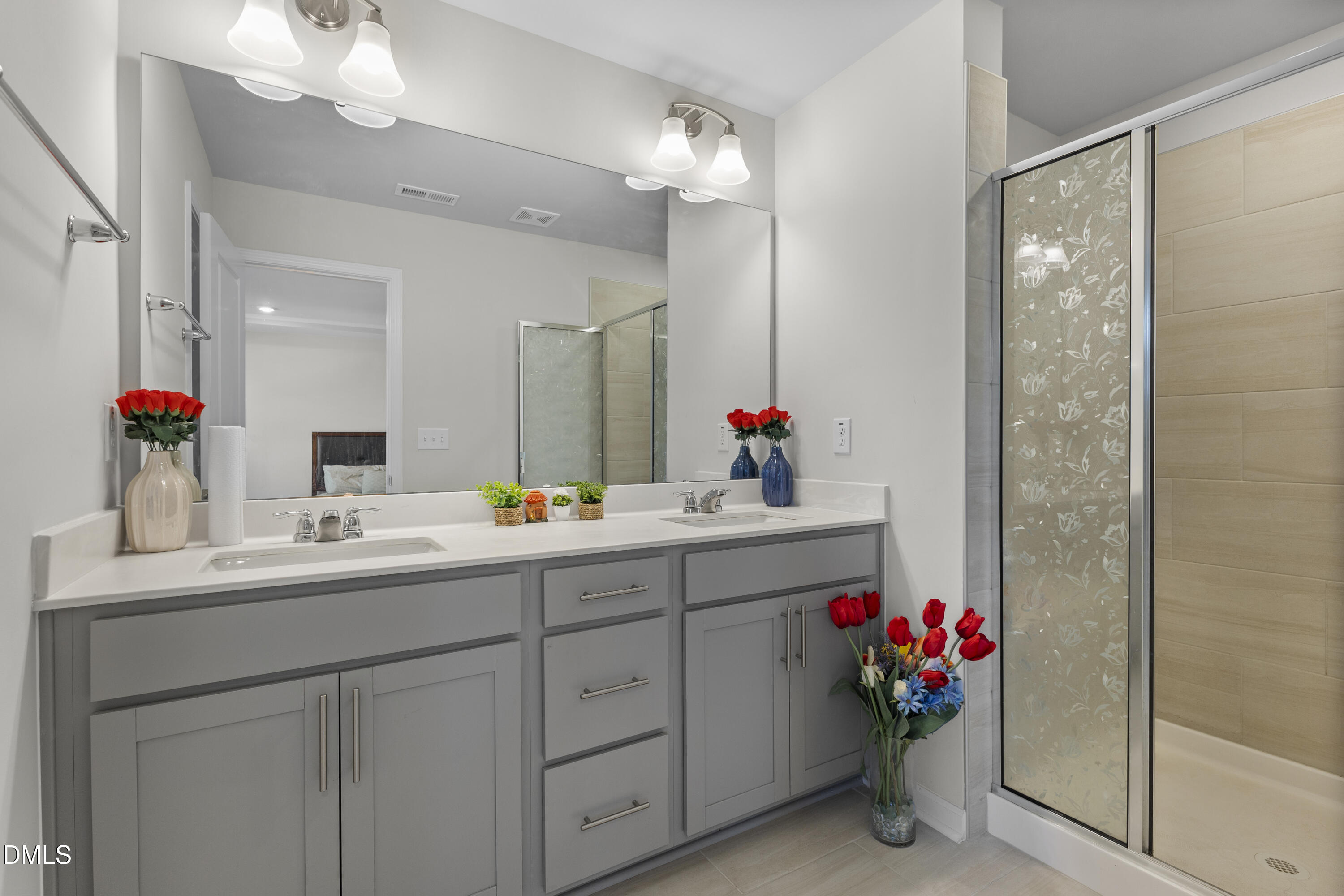 1811 Aspen River Lane Apex, NC 27502 - Photo 16 of 36 a bathroom with a sink vanity and mirror