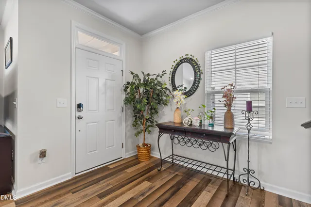 a bedroom with a bed chair and window