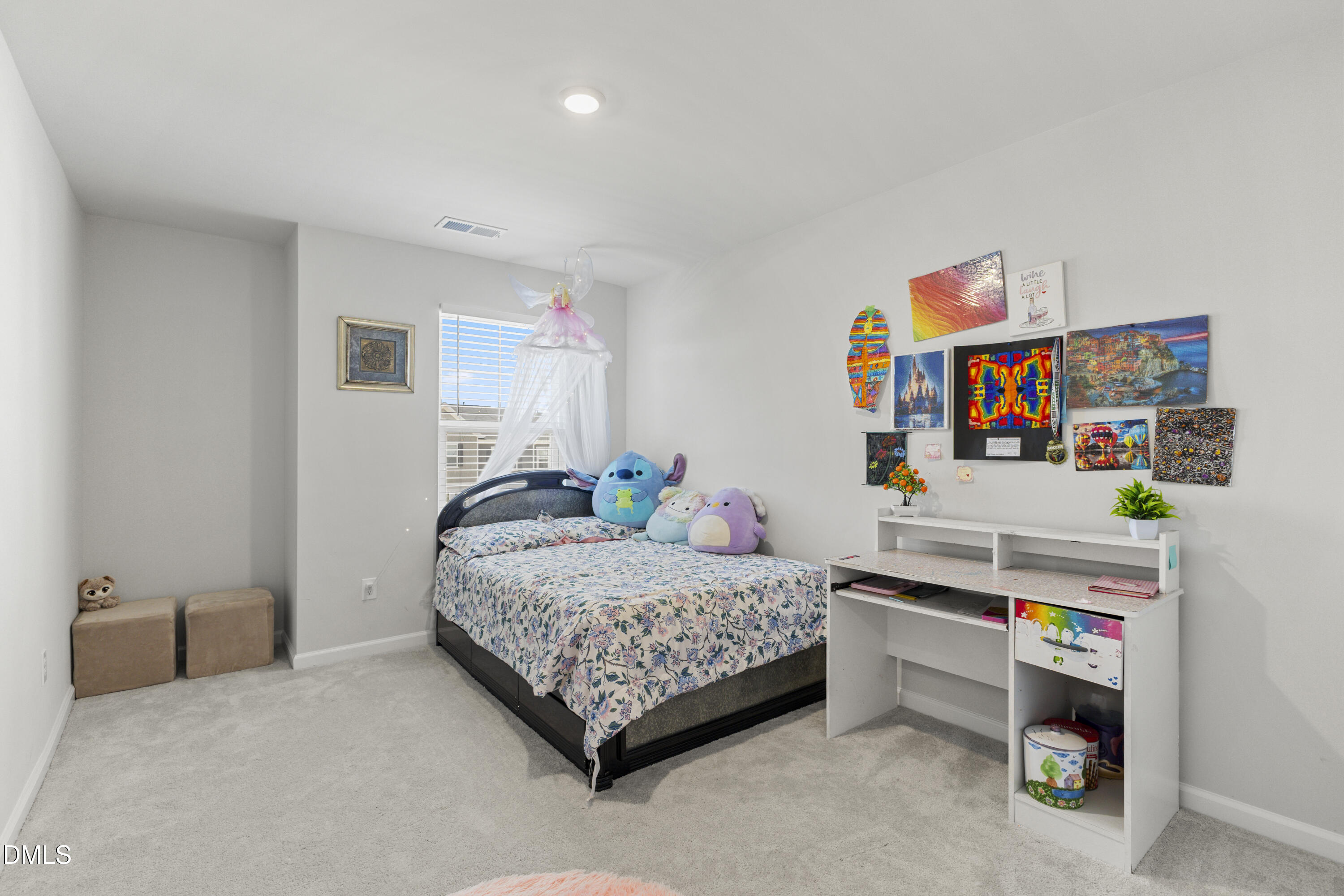 1811 Aspen River Lane Apex, NC 27502 - Photo 19 of 36 a bedroom with a bed and a desk