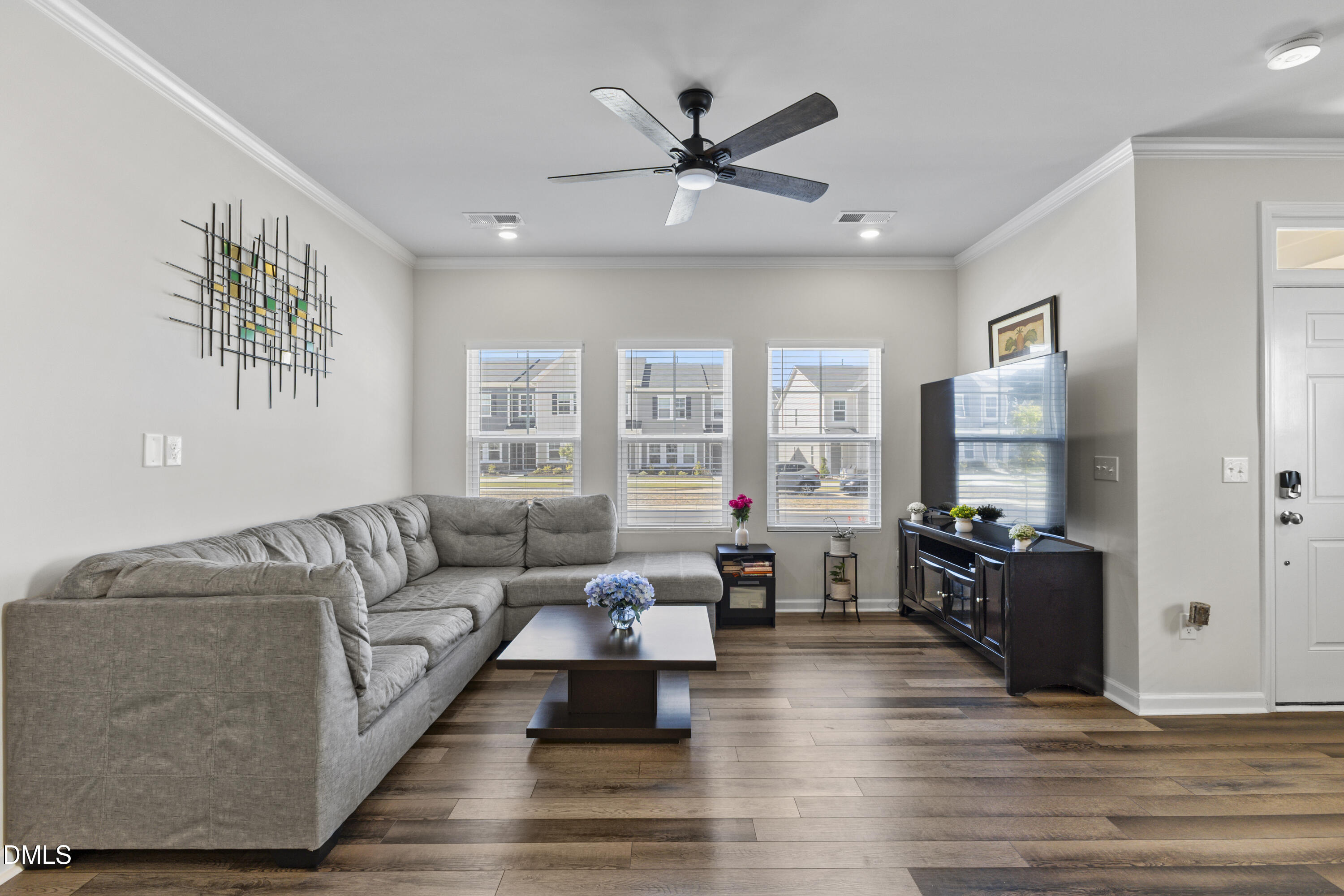 1811 Aspen River Lane Apex, NC 27502 - Photo 20 of 36 a living room with furniture and a wooden floor