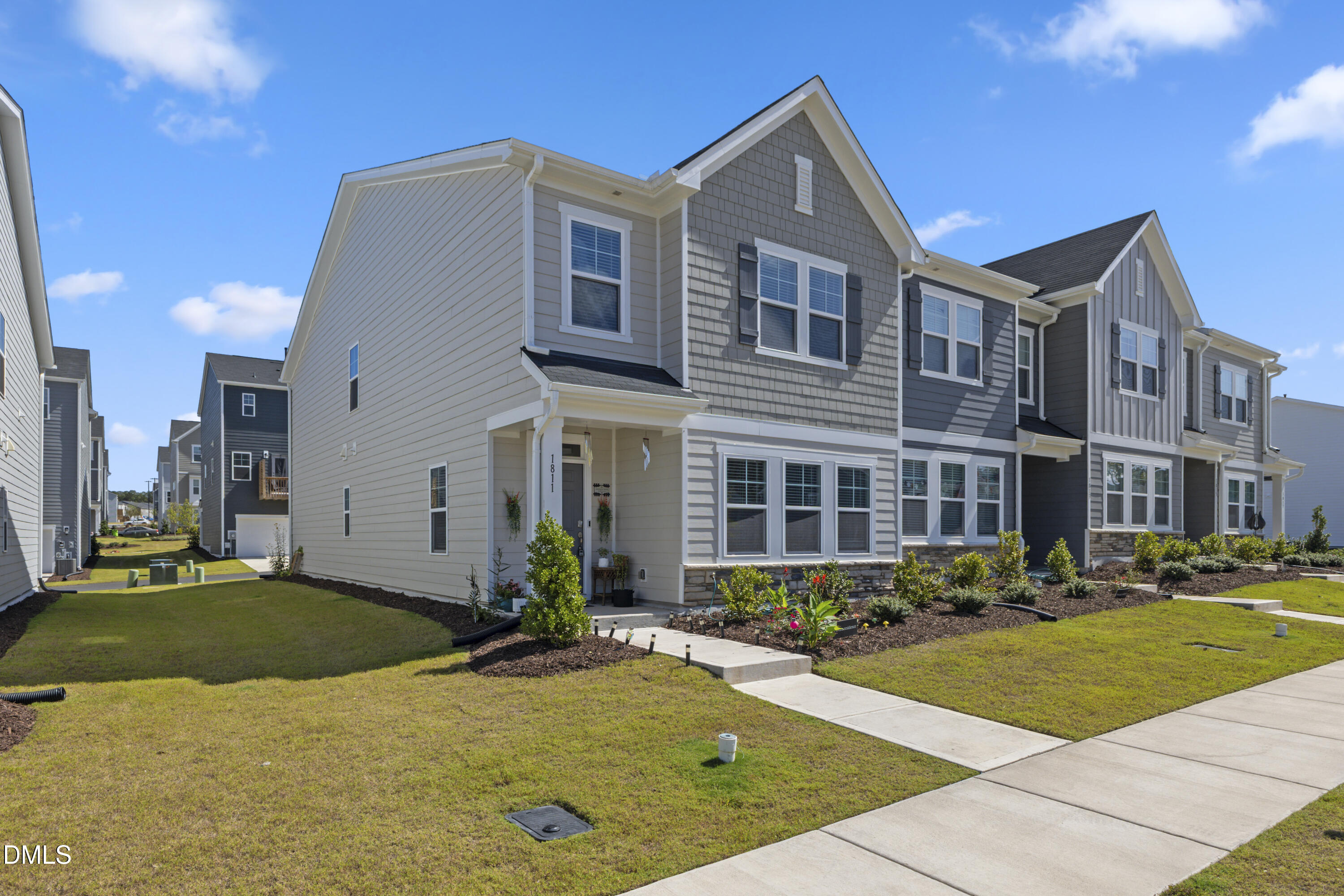 1811 Aspen River Lane Apex, NC 27502 - Photo 2 of 36 a front view of a house with a yard
