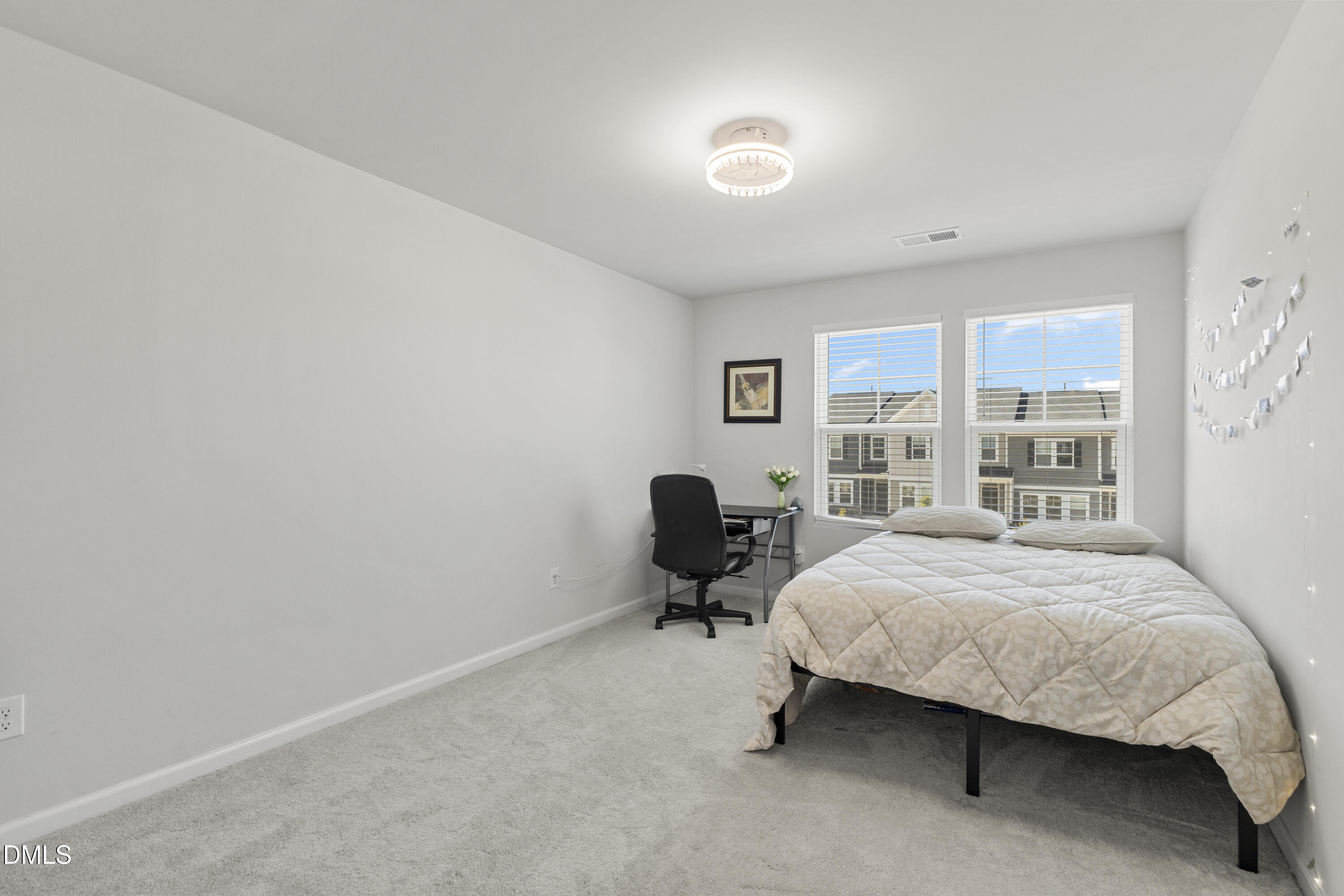 1811 Aspen River Lane Apex, NC 27502 - Photo 23 of 36 a bedroom with a bed chair and window