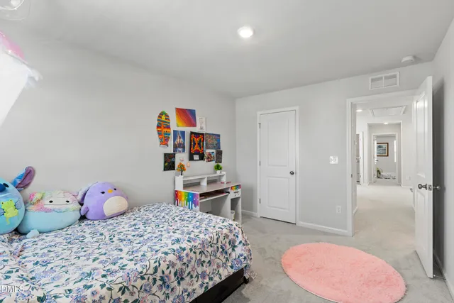 a view of a swimming pool with a patio and a mountain view