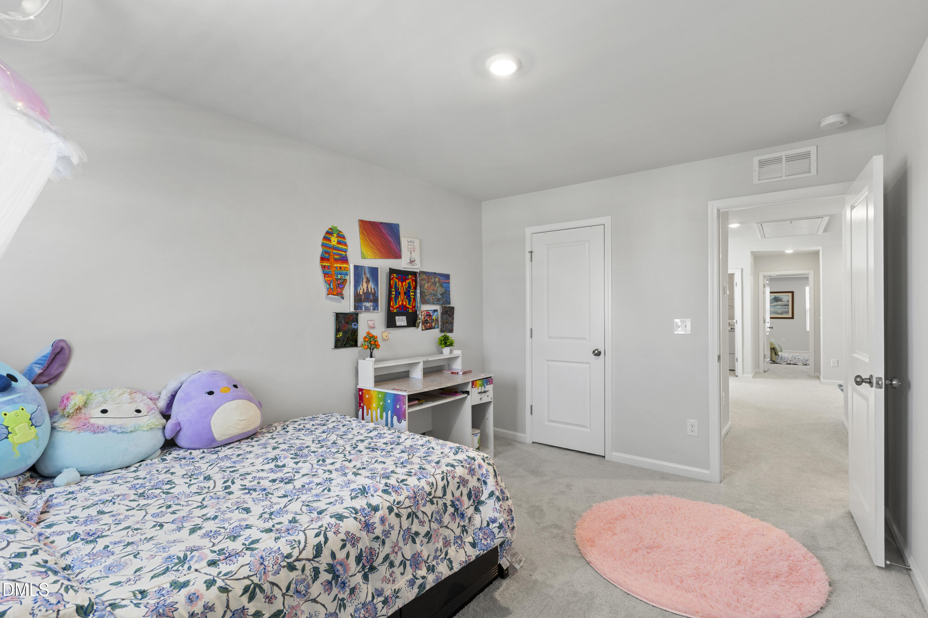 1811 Aspen River Lane Apex, NC 27502 - Photo 24 of 36 a bedroom with a bed and a desk