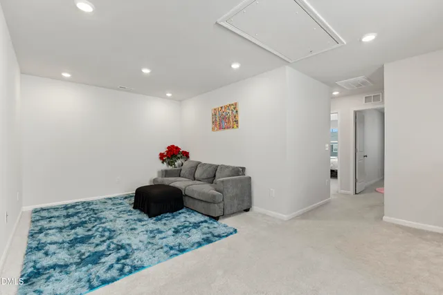 a view of a swimming pool with outdoor seating