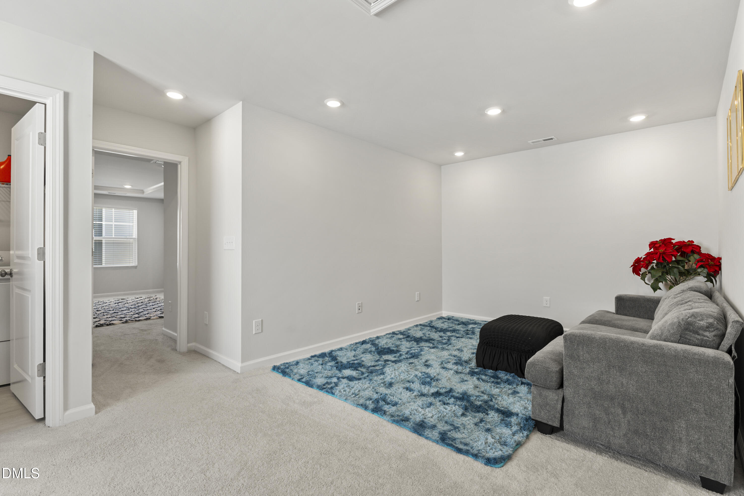 1811 Aspen River Lane Apex, NC 27502 - Photo 26 of 36 a living room with furniture and a view of bathroom
