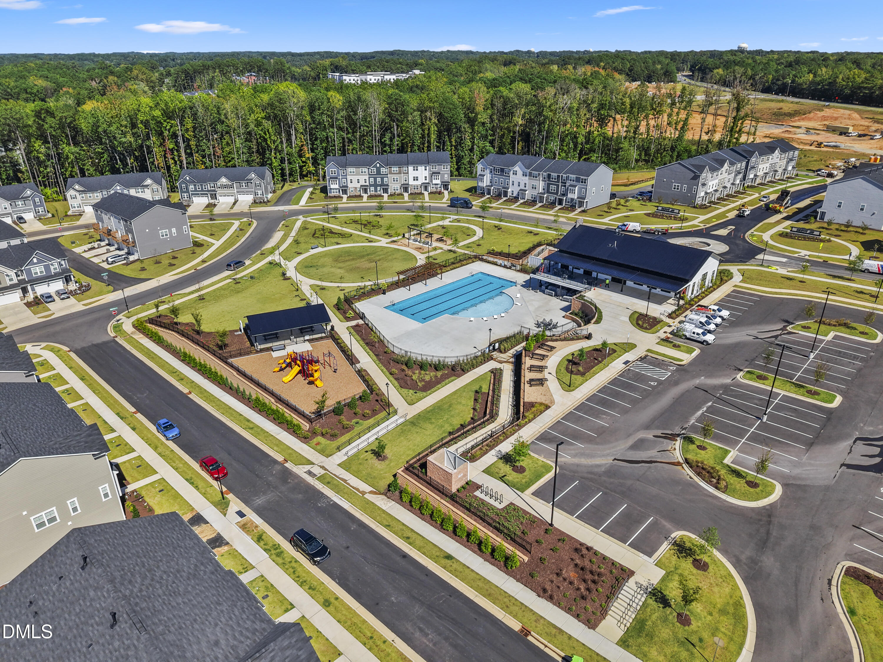 1811 Aspen River Lane Apex, NC 27502 - Photo 34 of 36 a view of swimming pool with seating area and hardwood roof