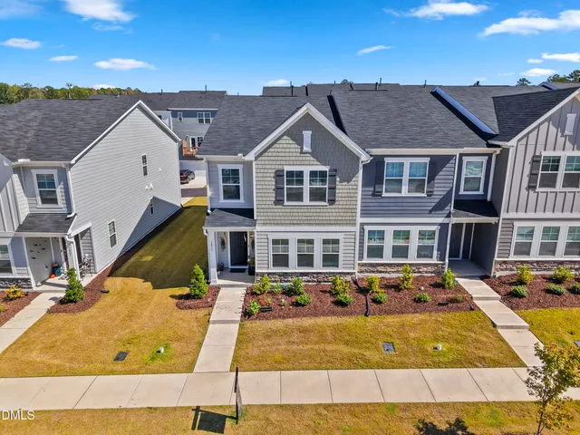 a view of a pathway with flower pots
