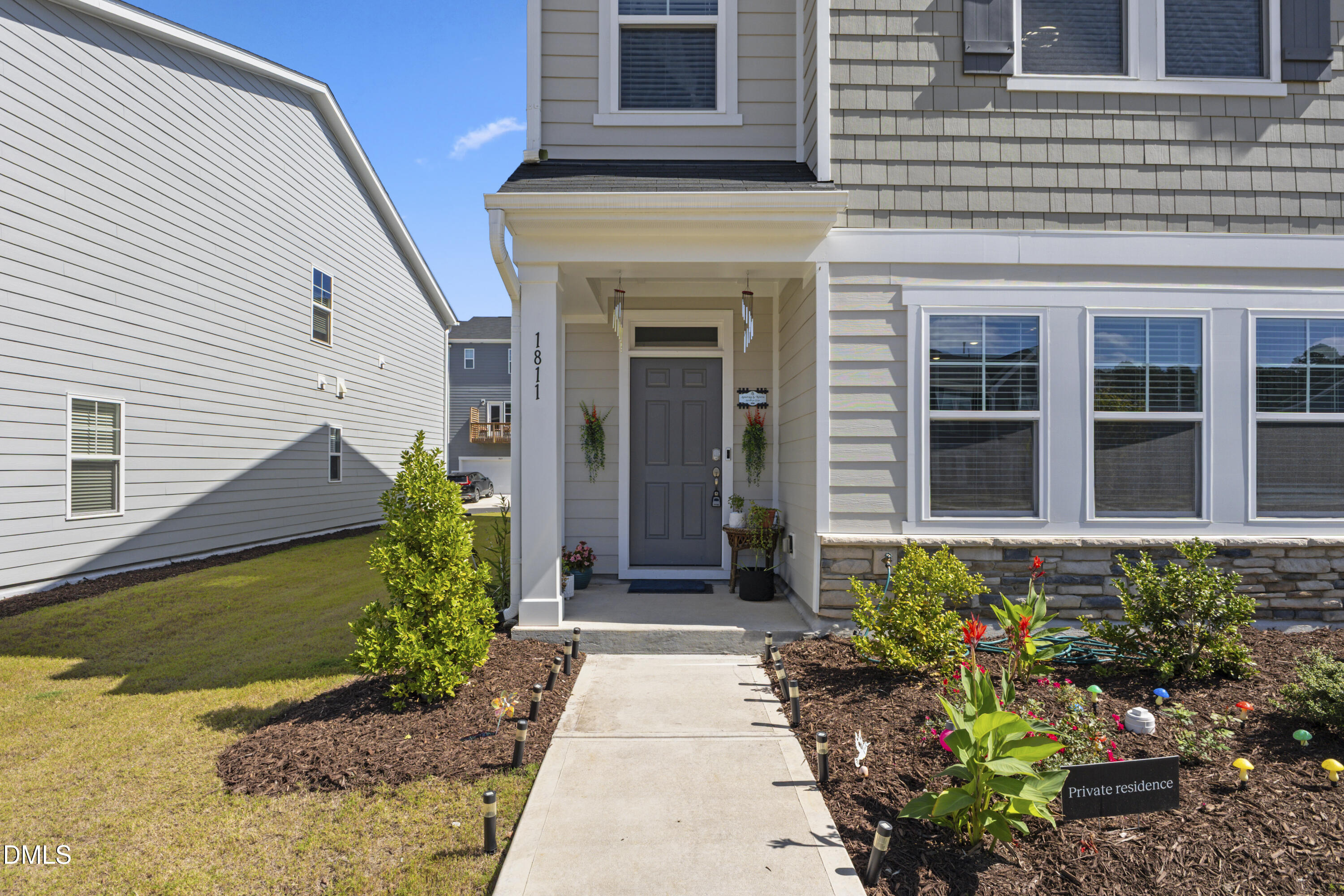 1811 Aspen River Lane Apex, NC 27502 - Photo 5 of 36 a view of a pathway with flower pots