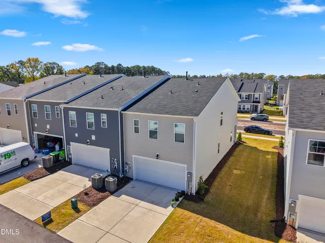 a kitchen with a sink stove top oven and refrigerator
