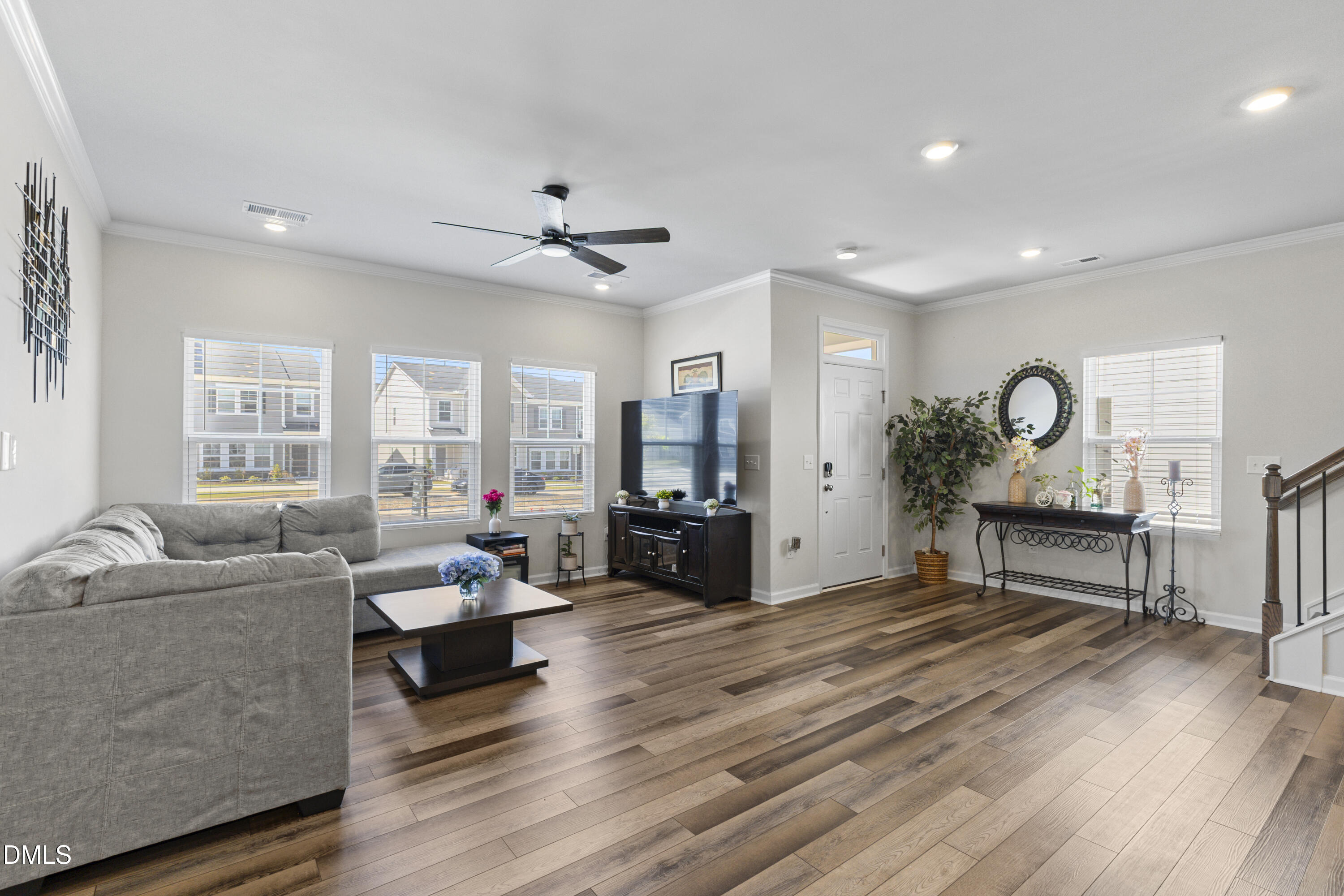 1811 Aspen River Lane Apex, NC 27502 - Photo 9 of 36 a living room with furniture and a wooden floor
