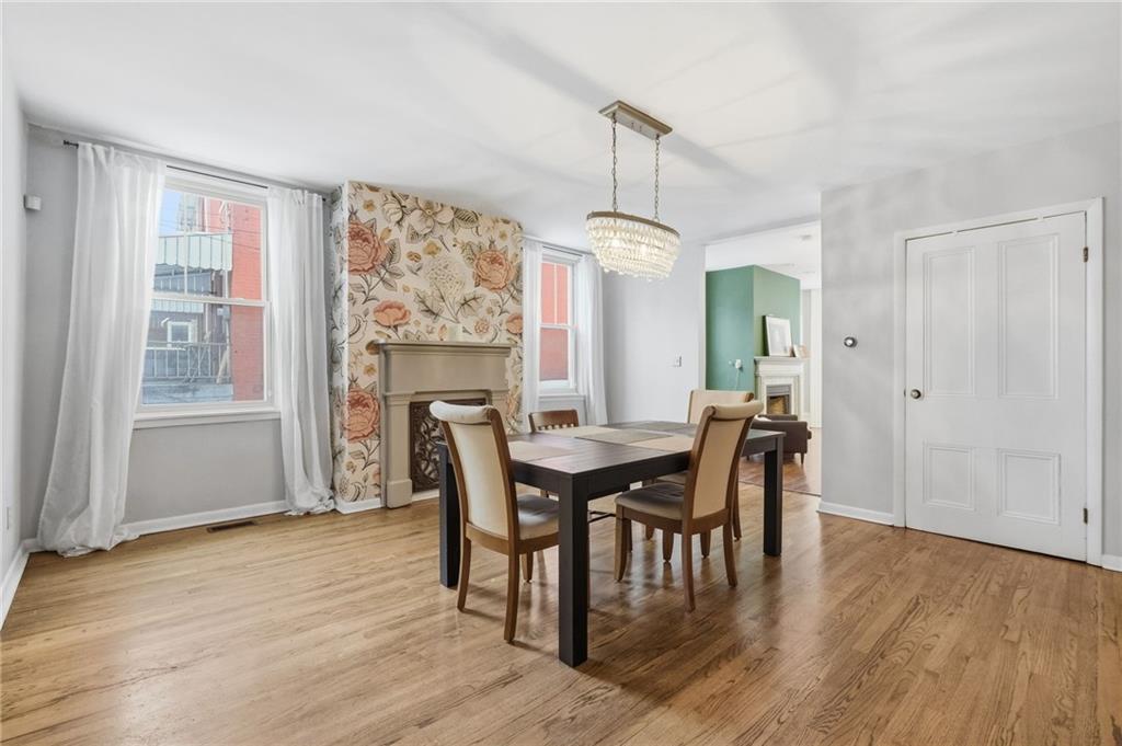 1311 Breed Street Pittsburgh, PA 15203 - Photo 12 of 44 a view of a dining room with furniture window and wooden floor